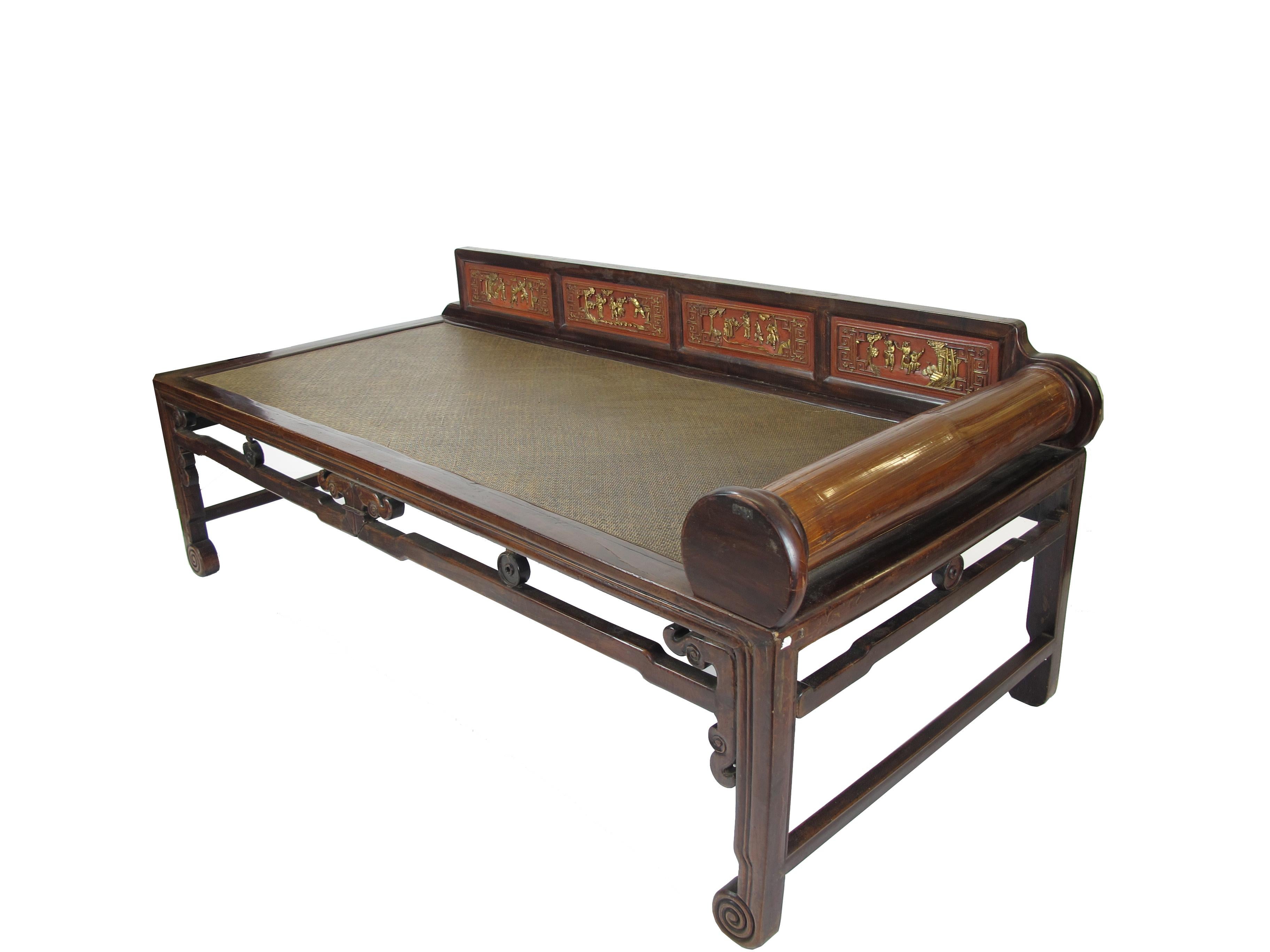 This pretty antique Chinese daybed is from southern part of China. It is light weighted as the top of the bed is made of rattan only. With slim legs, latticework frame, hand pained low rail, and head set, this lovely daybed will be a lovely and