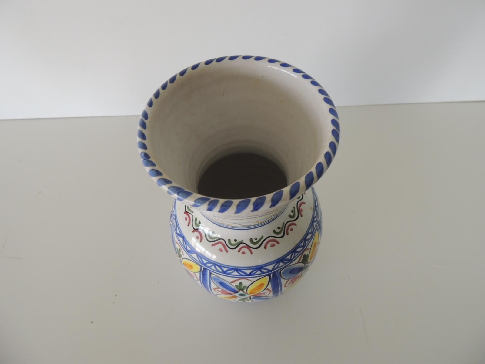 Hand painted round Spanish ceramic decorative vase
De la barreira puente pottery.
In shades of blue, white, yellow and green.
Size: 5