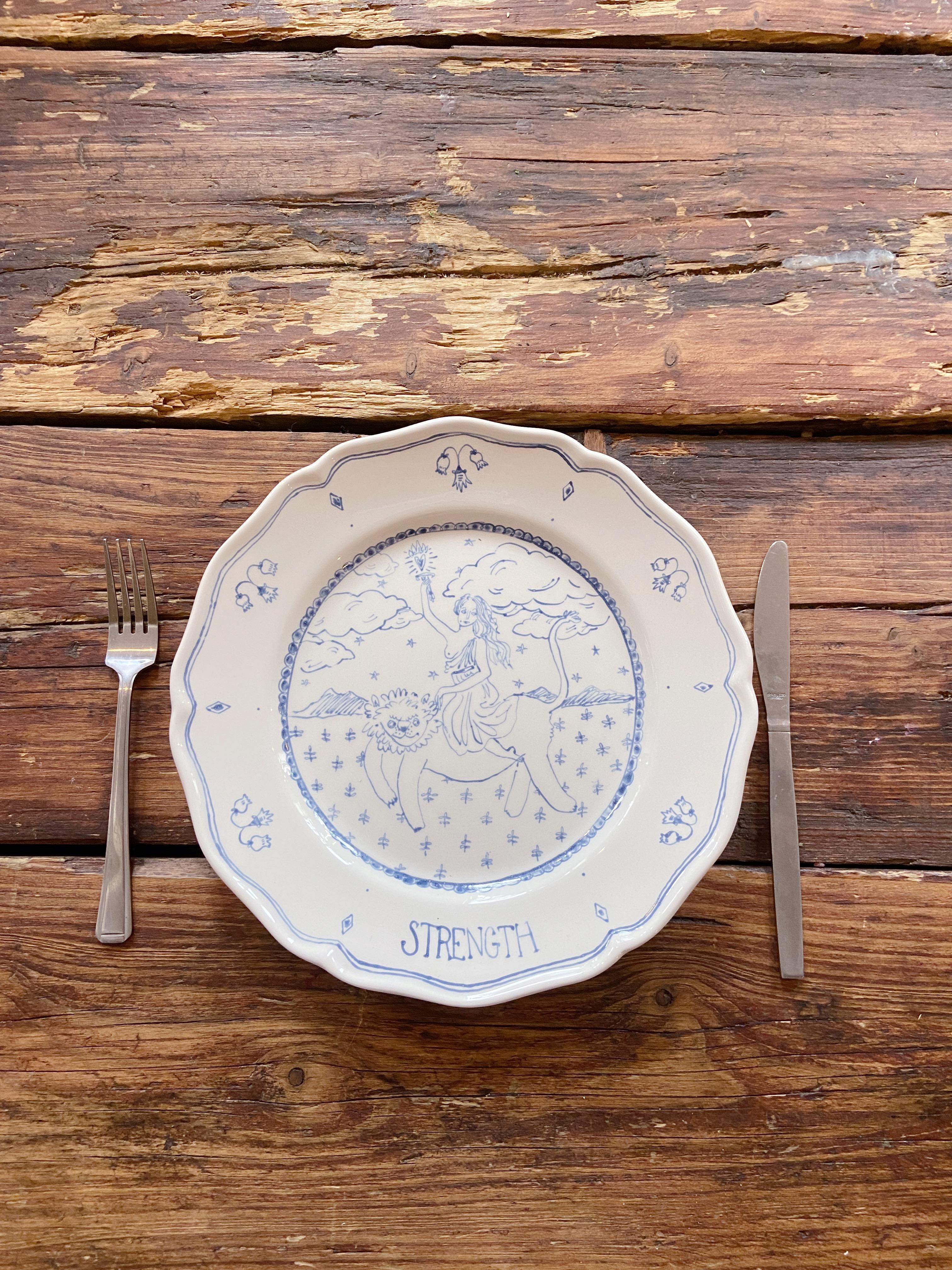 Hand painted onto luxury Italian Ceramic by artist Josephine Dessine. This unique blue and white plate is hand painted and kiln fired to create a luxurious decorative or serving piece to adorn any dining experience. 

Inspired by the Delftware of