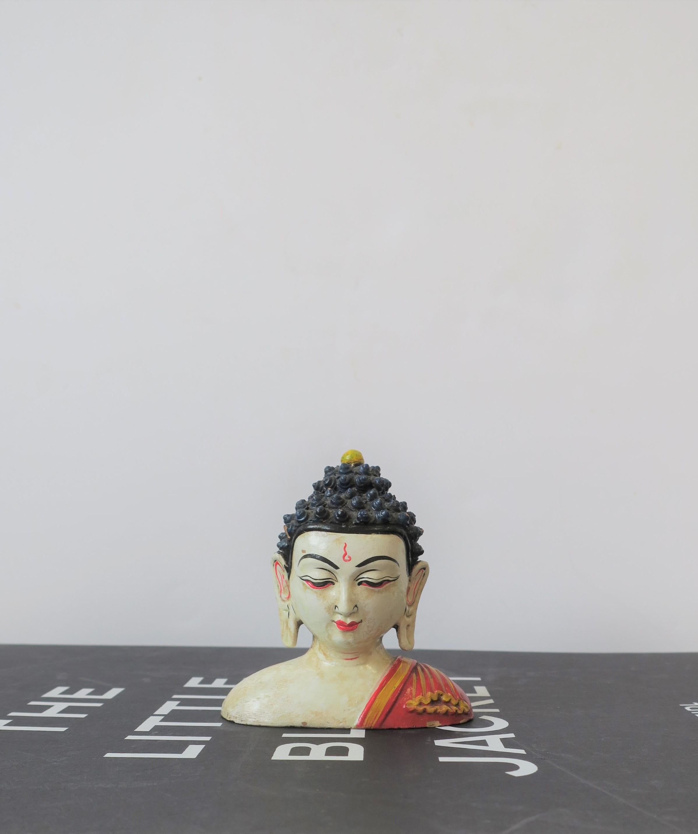 A beautiful, small, hand-painted terracotta pottery Buddha head bust sculpture piece, circa 20th century, Asia. 
A great piece for a desk or vanity area, etc. Piece measures: 2.25