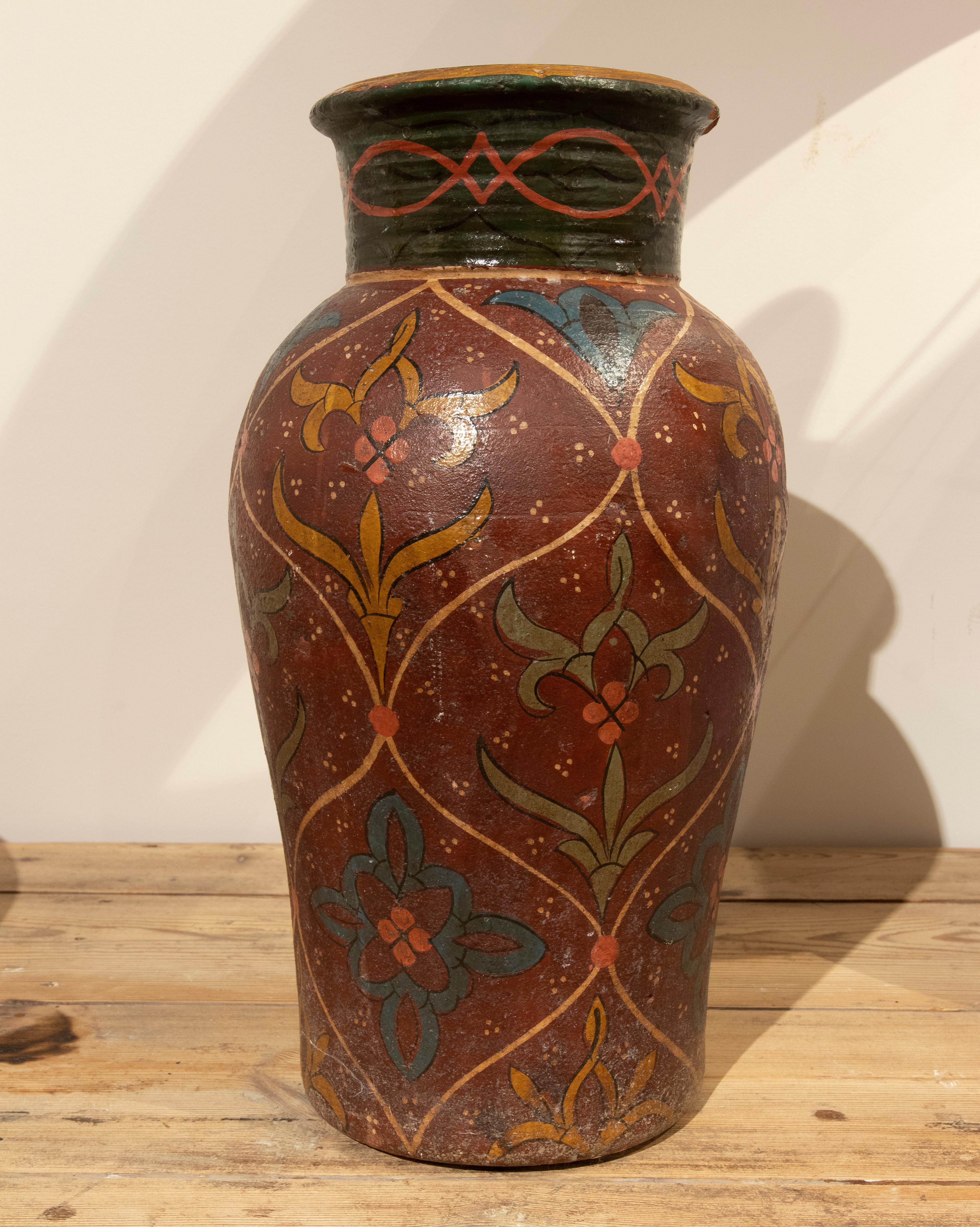 Hand-Painted Terracotta vase with flower decoration.