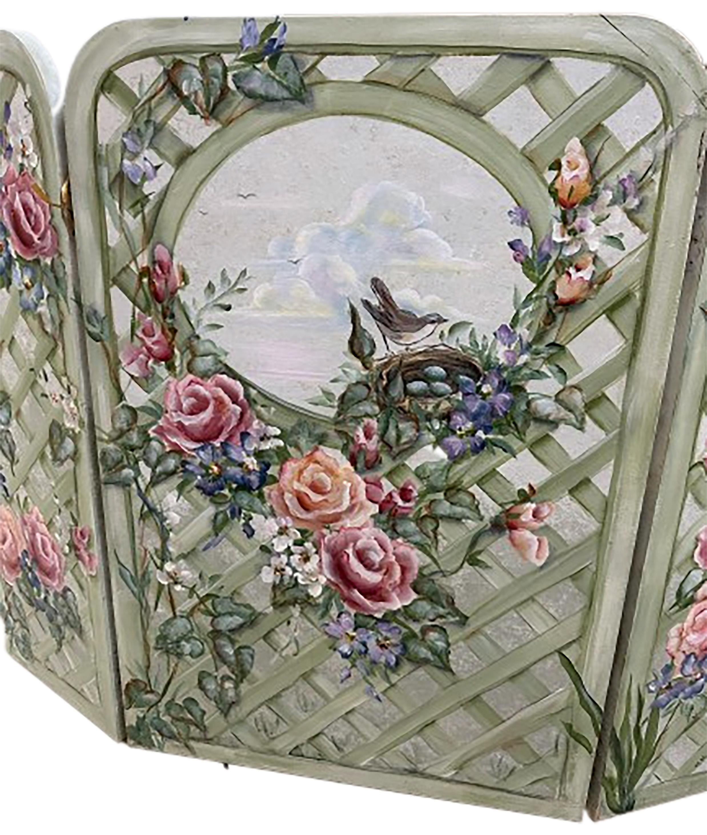 A charming hand painted three panel. Great as a piece of art or as a fireplace cover. Late 20th century. This piece depicts a painting of a lattice and garden with a selection of orange and red roses. Vines with purple and white flowers. An oval in