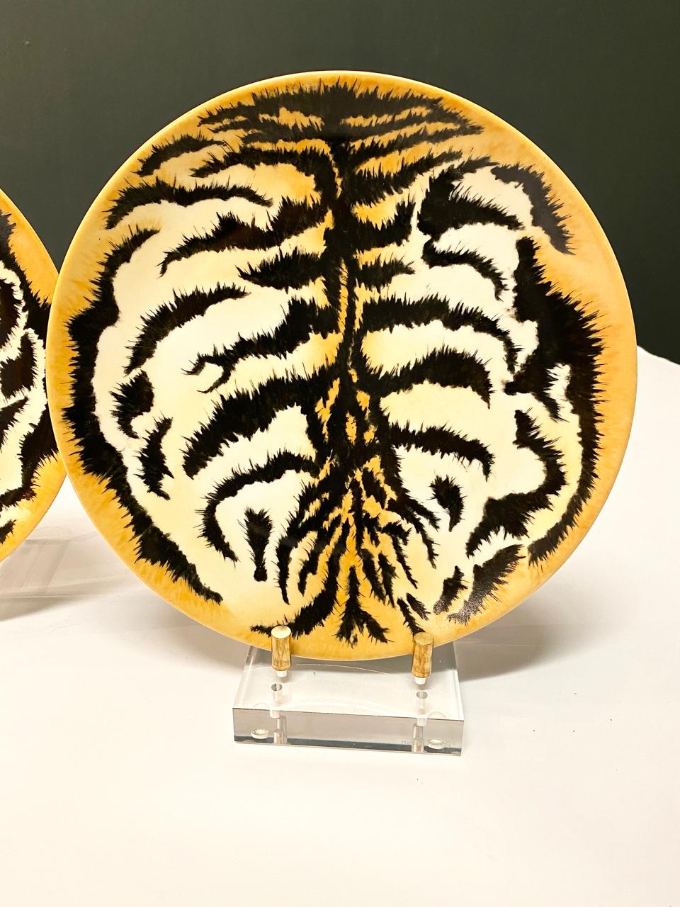 This is a highly decorative set of signed 9 dinner plates hand painted by the well-respected Odette de Bumiere, Palm Beach, 1988. These hand painted tiger plates would make a statement when hung together as a grouping.