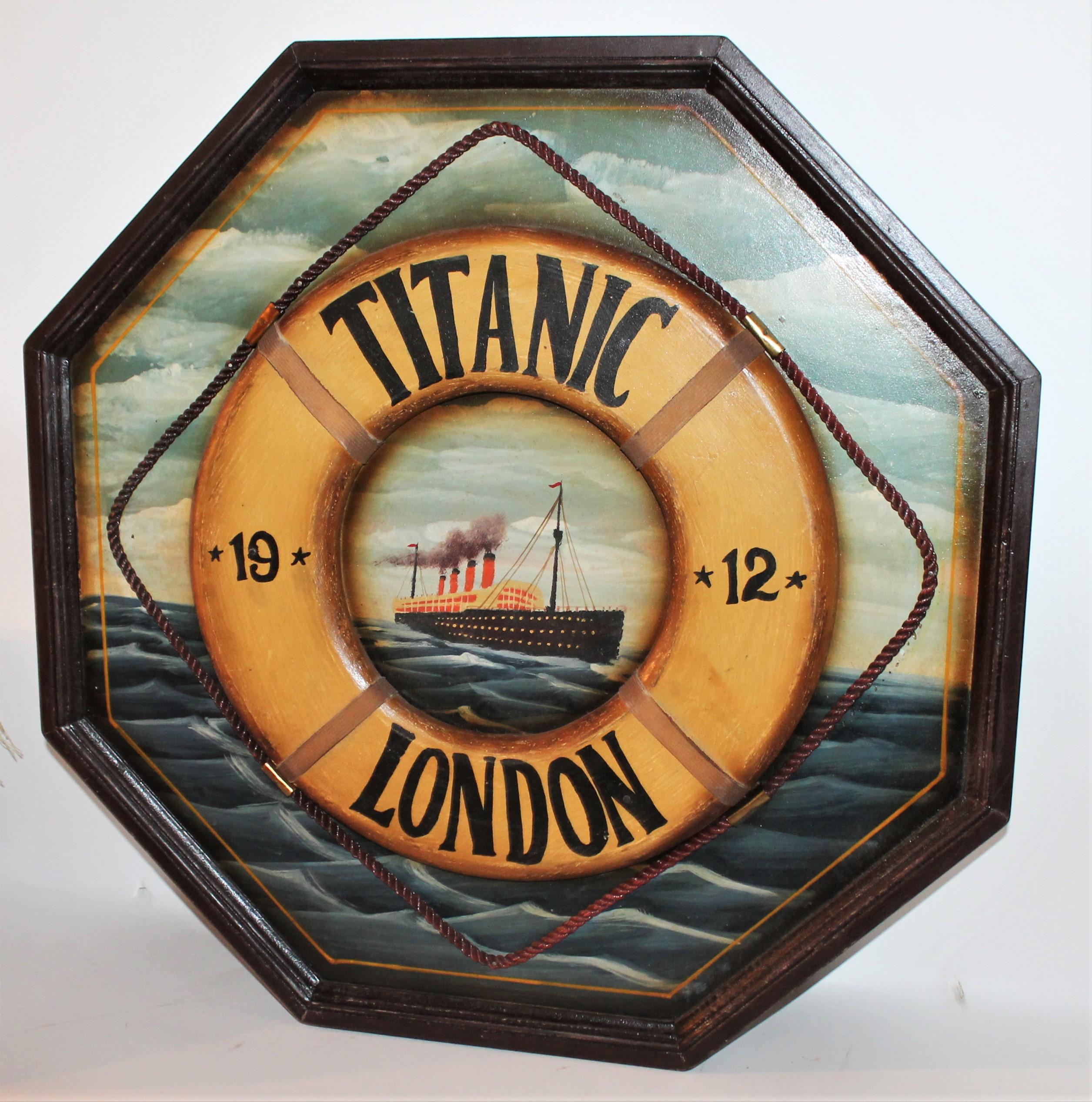 This handmade and painted Titanic trade sign is in good condition with wear on trim and small scratches throughout. This is a remake of the 19th century style trade signs. It reads 