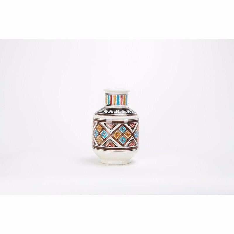 This beautiful hand painted decorative vase features a mesmeric arabesque pattern and inviting brown, orange and blue, black and red. Perfect as an elegant centerpiece on your dining room or kitchen table, living room or any space.

Dimensions: H