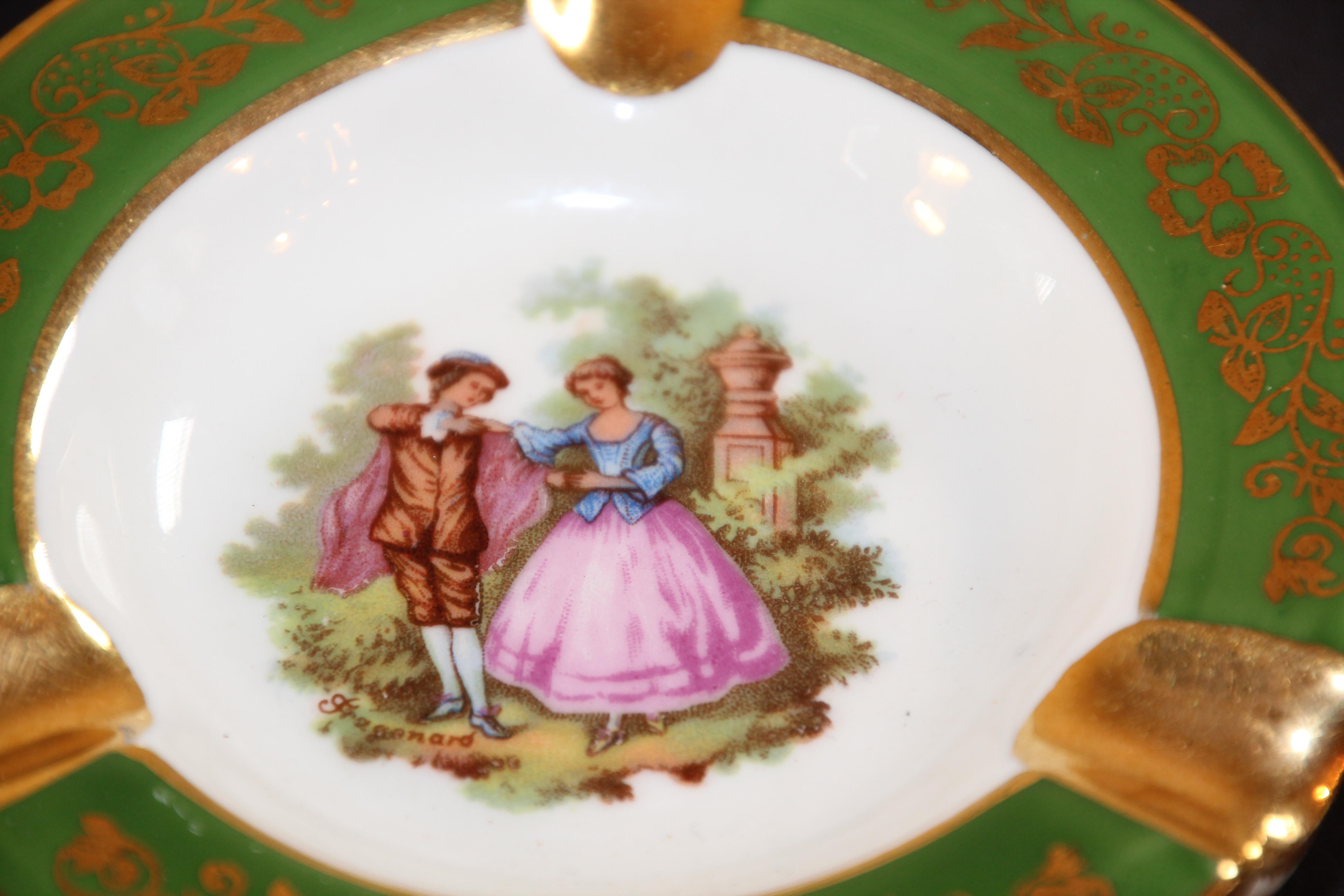 Vintage limoges France porcelain round ashtray green and gold.
Elegant precious porcelain ashtray hand painted with a scene of a couple in the style of Fench artist Fragonard.
Use it as an ashtray or for decorative accent.
Limoges made in France