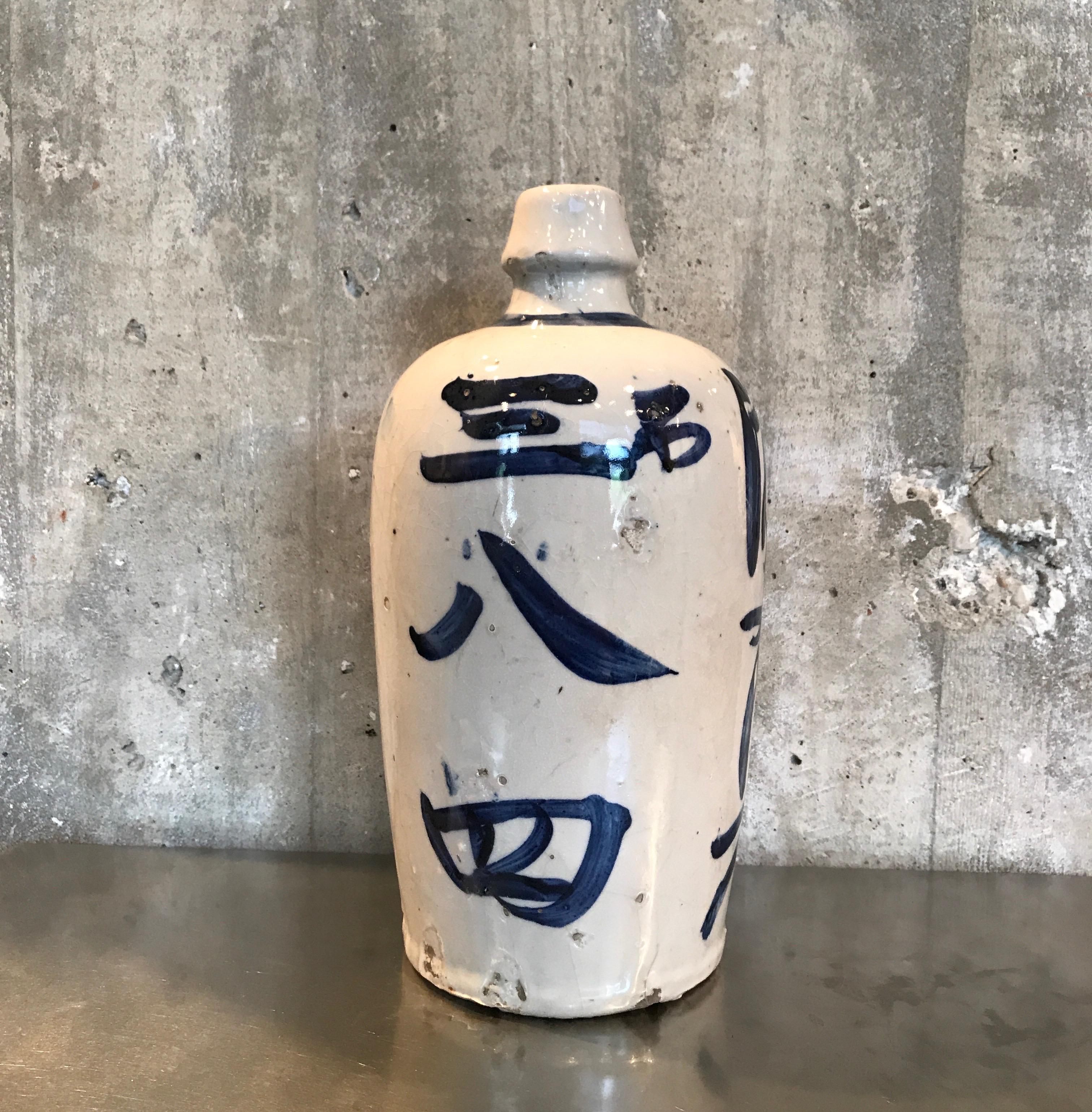 A beautifully glazed and hand painted Japanese sake bottle with gorgeous calligraphy on all sides. A wonderful shelf piece, Japan, circa 1960.
CR1006.