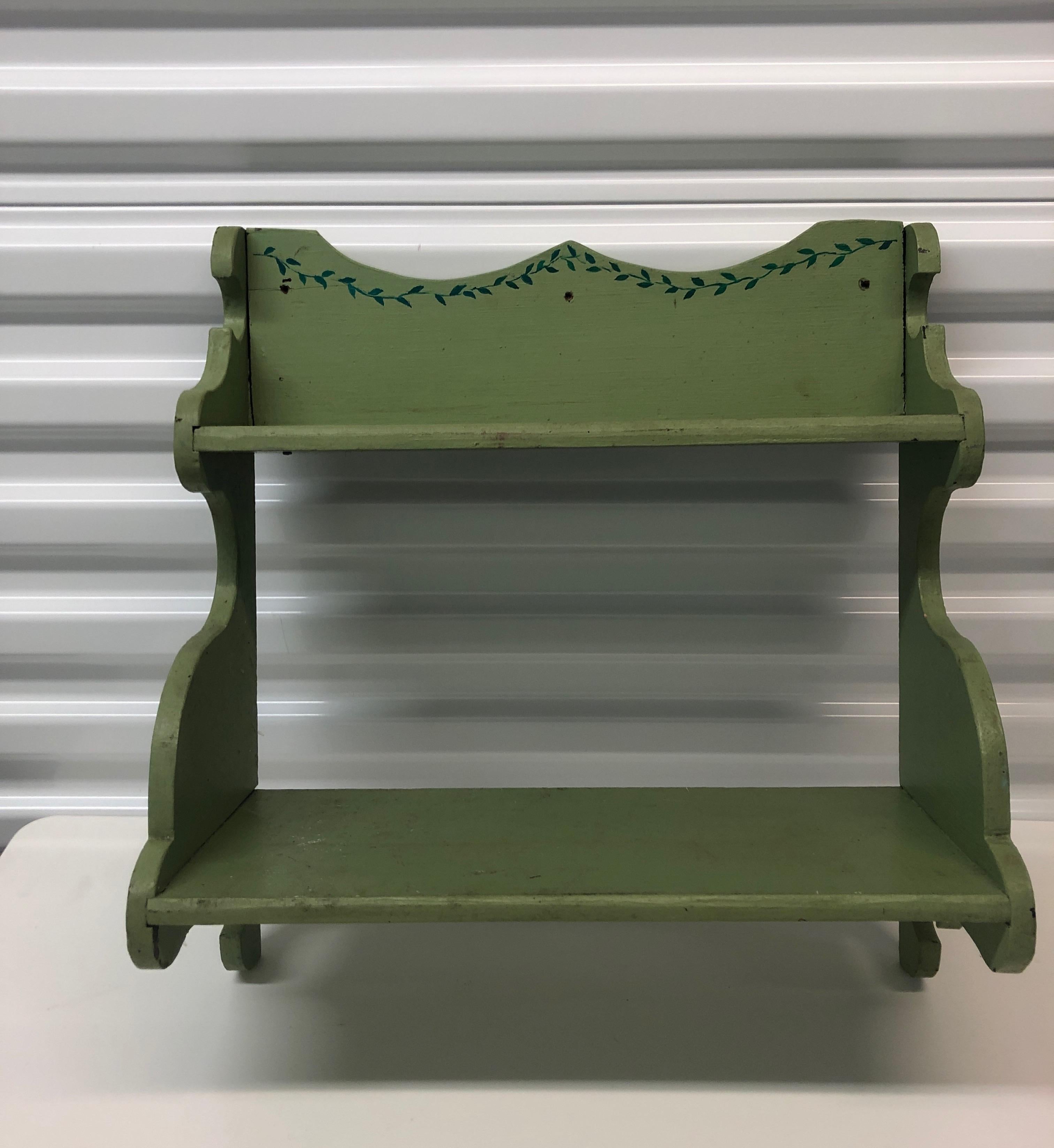 Hand painted wooden country wall display shelf.
Green high gloss paint with royal blue details.
Three small holes to either nail it or screw it to the wall or door.
Size: 18” H x 17” W x 7.5” D.