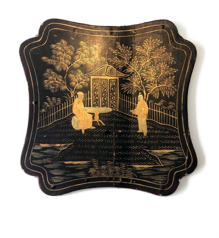 Hand-painted wooden Manton Manila shawl box lid (Canton) China 19th century

Nineteenth-century Manton box lid, Canton China, featuring black and red lacquer. Hand-painted central decoration showcases two gold characters in a Chinese garden against