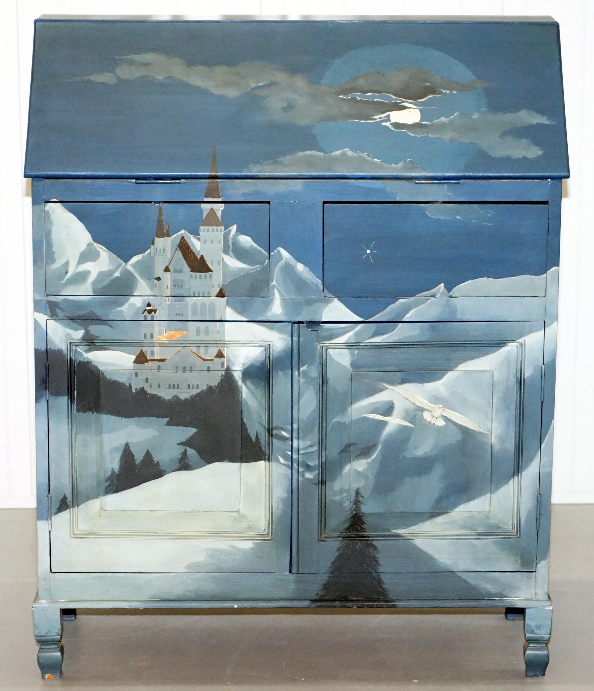 We are delighted to offer for auction this lovely hand painted writing Bureau depicting Neuschwanstein castle in Bavaria Germany in the mountains

There are around 50-100 high definition super-sized pictures at the bottom of this page

A very