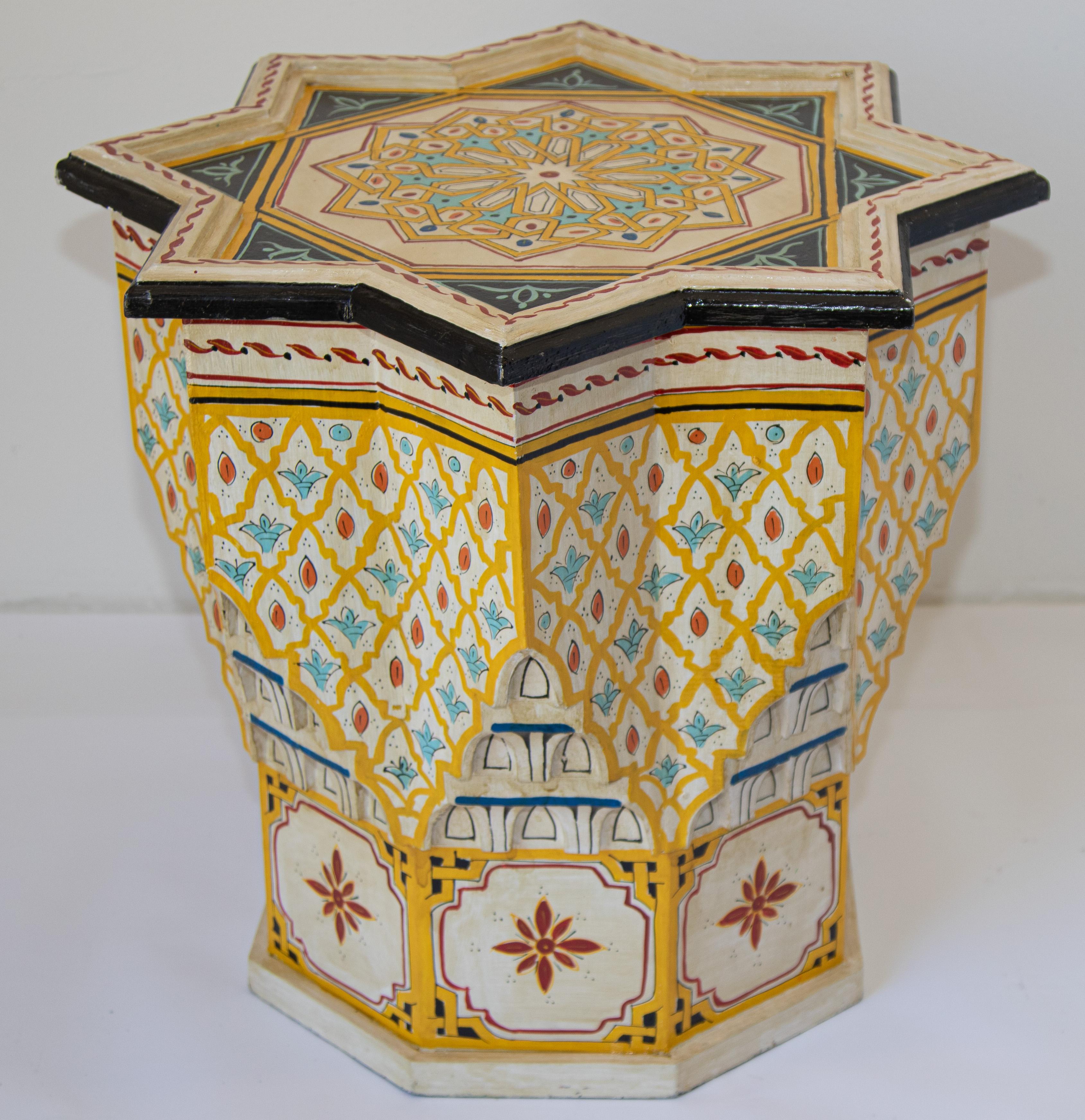 Moroccan colorful yellow color hand painted and carved side occasional table with Moorish designs.
Vintage Moroccan Pedestal table in yellow background with multicolored floral and geometric designs.
Very decorative Moroccan table with fine
