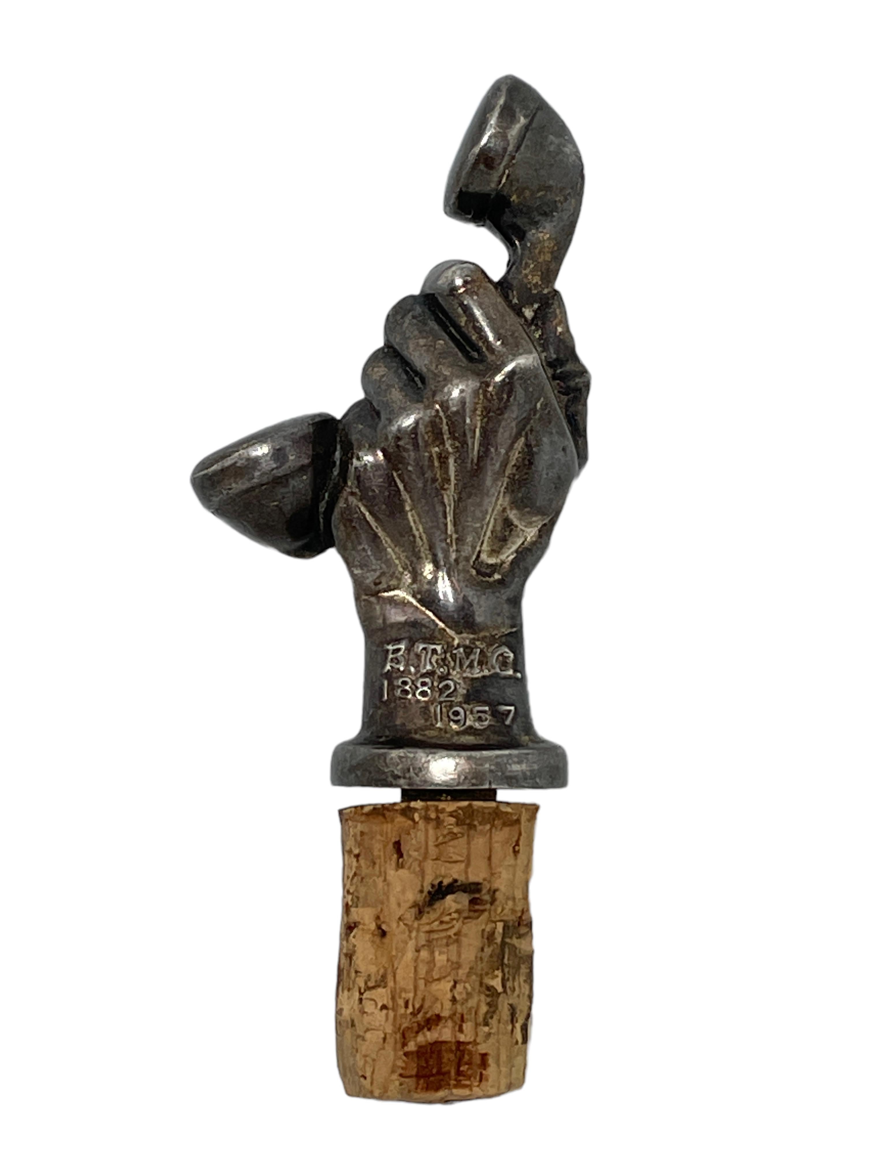 A beautiful metal and cork bottle stopper. Some wear with a nice patina, but this is old-age. Made of metal and cork. A beautiful nice barware item or just a display item in your collections of antique bottle stoppers. Found at an estate sale in