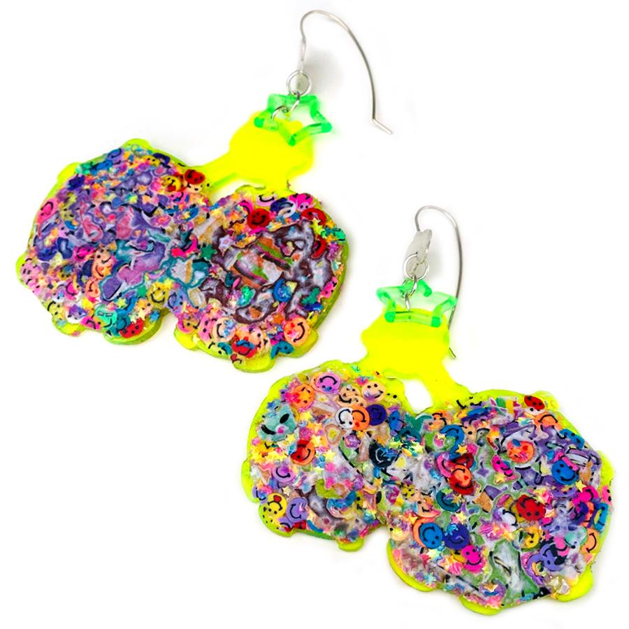 Hand pierced and fabricated earrings with fine silver hook earrings. Electric neon plastic adorned with stickers and glitter made by MANDO BEE.