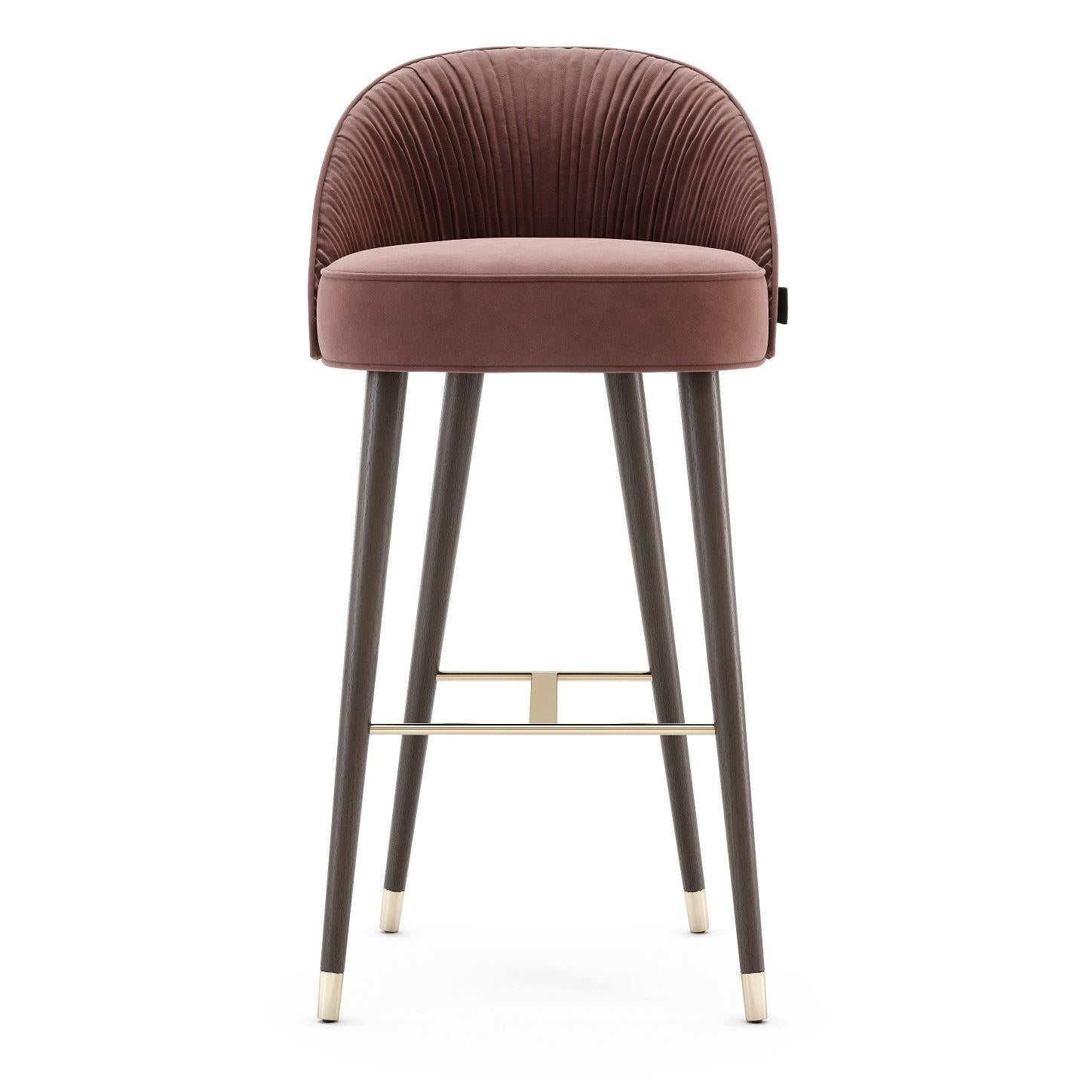 The contemporary bar chairs hold a stimulating design, as they hold an elegant combination of handmade couture techniques, wood, and metal. Their shapes are inspired by the unique French couture and each detail will elegantly flow inside of an