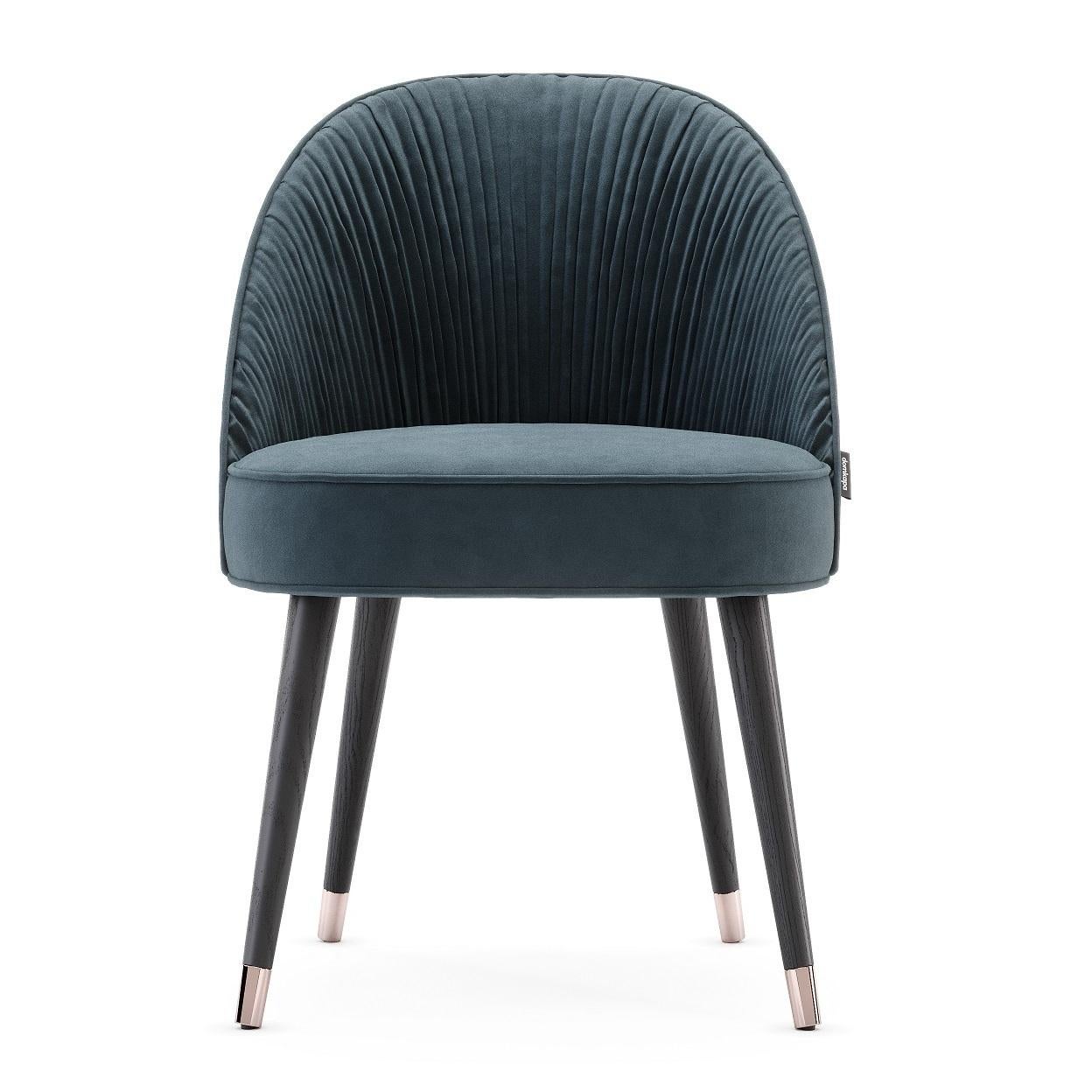 The contemporary dining chairs hold a stimulating design, as they hold an elegant combination of handmade couture techniques, wood, and metal. Their shapes are inspired by the unique French couture and each detail will elegantly flow inside of an