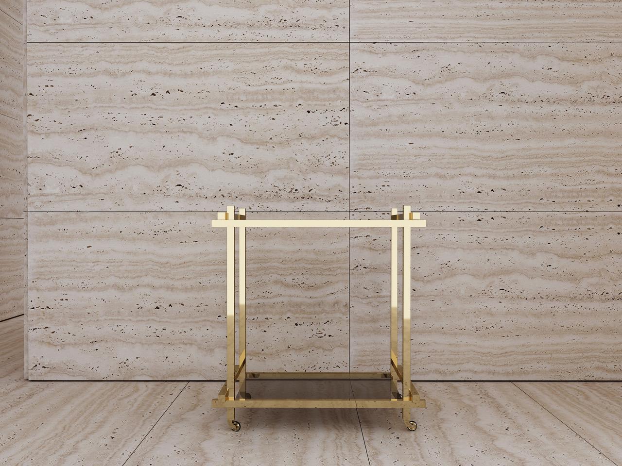 Bar cart in hand polished solid brass, handcut and wrapped nubuck leather handles and rubber banded solid brass casters.

Approximate dimensions:
W 74 x D 52 x H 82 cm

All pieces are stamped and dated according to year of production. 

Bar cart is