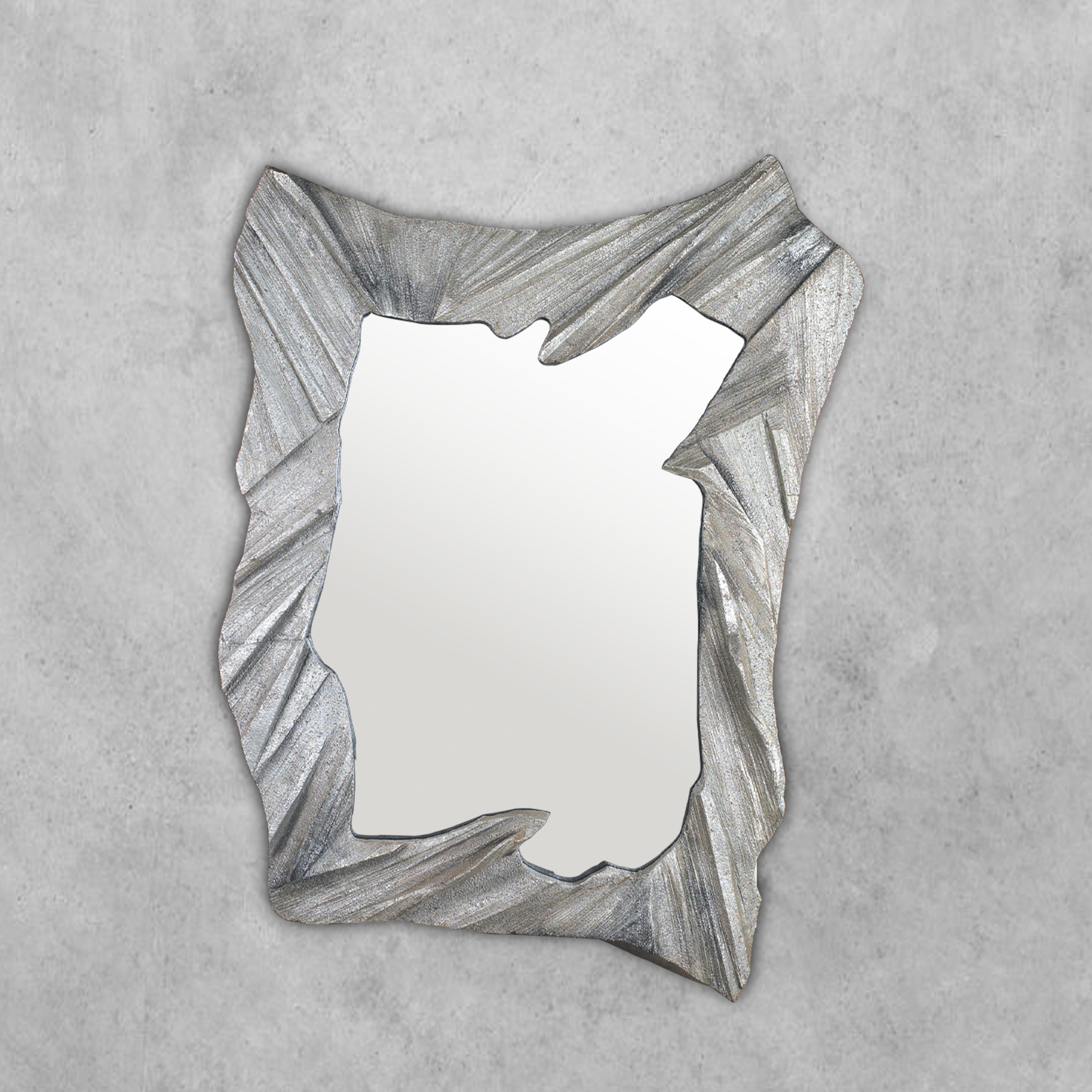 inspired by nature and realized by a technique developed especially for Farrago Design, this sculpture mirror is individually sand-cast in Aluminum. The molds are hand-carved in packing styrofoam and can be used only once, making this piece truly