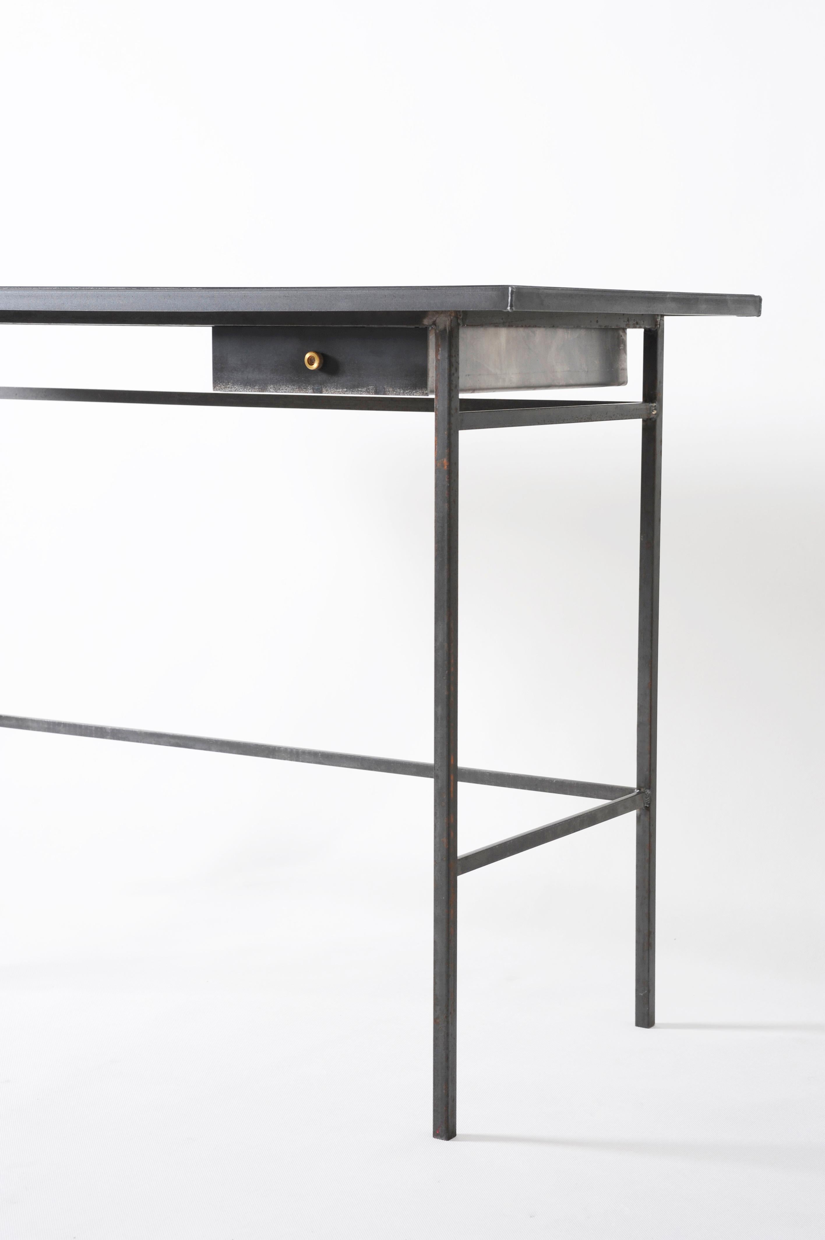 Hand, sculpted desk, signed by Lukas Friedrich
Desk “Gloomy Sunday”
Measures: 110 x 50 H 76 cm
Finish: raw, waxed steel with brass drawer knob
Top: dyed and oiled oak veneer (other options on
demand)
Limited Edition of 50
Signed