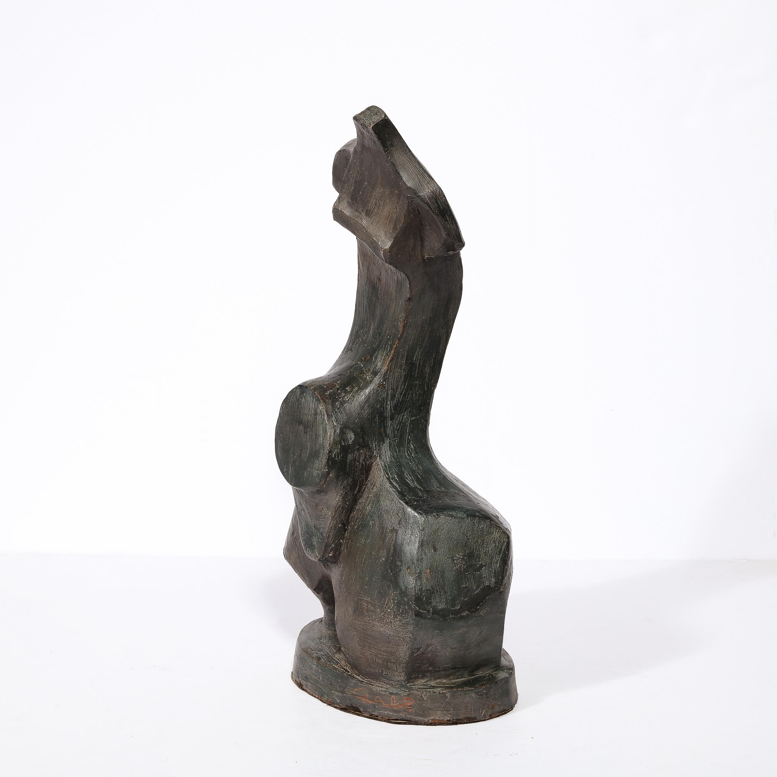 This sophisticated and alluring Mid-Century Modern Sculpture was realized in France circa 1950. Executed in terra cotta with a oil rubbed bronze colored glaze, the work presents an abstract and dynamic form- bristling with verve. An elongated form