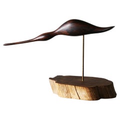 Escultura de pájaro costero de palisandro esculpida a mano según Emil Milan