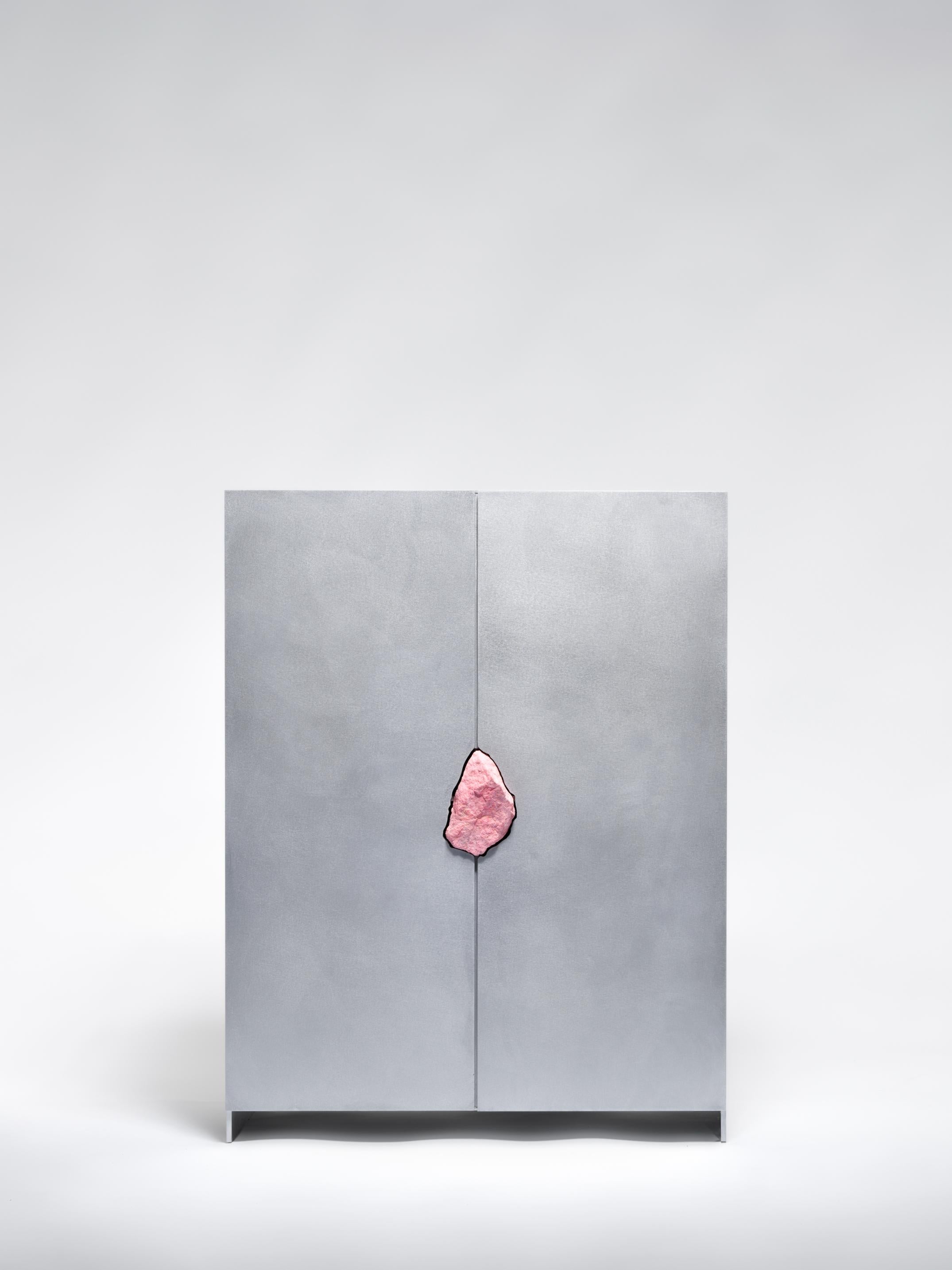 Hand-sculpted side cabinet with original Thulite stone, Pierre De Valck
Oxidized and waxed aluminium-unique and signed
Measures: W 55 x D 34 x H 70 cm
Materials: Stone, Aluminium.

Small sized cabinet with two hinged doors and four shelves.