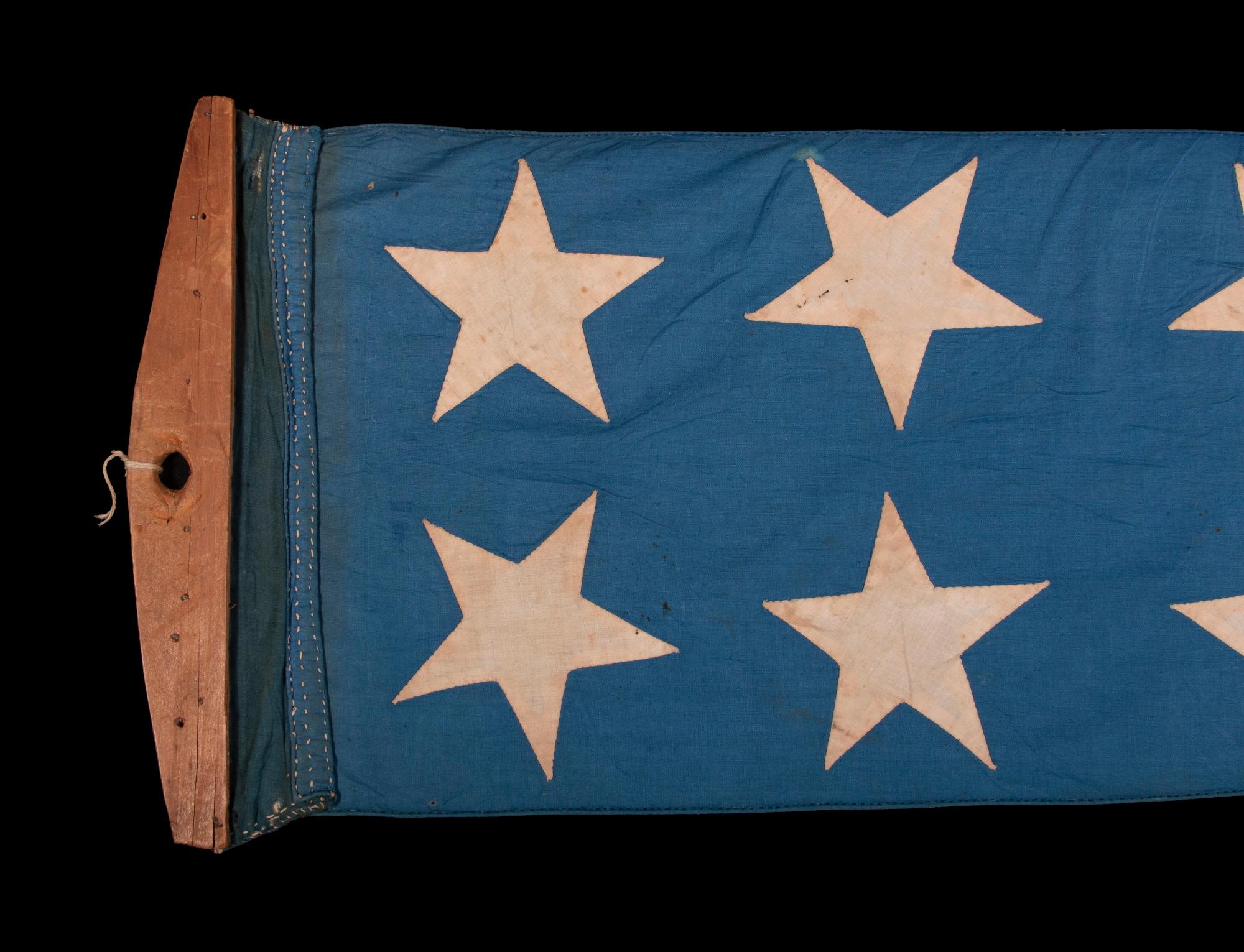 what is the only pennant or flag that is positioned above the national ensign