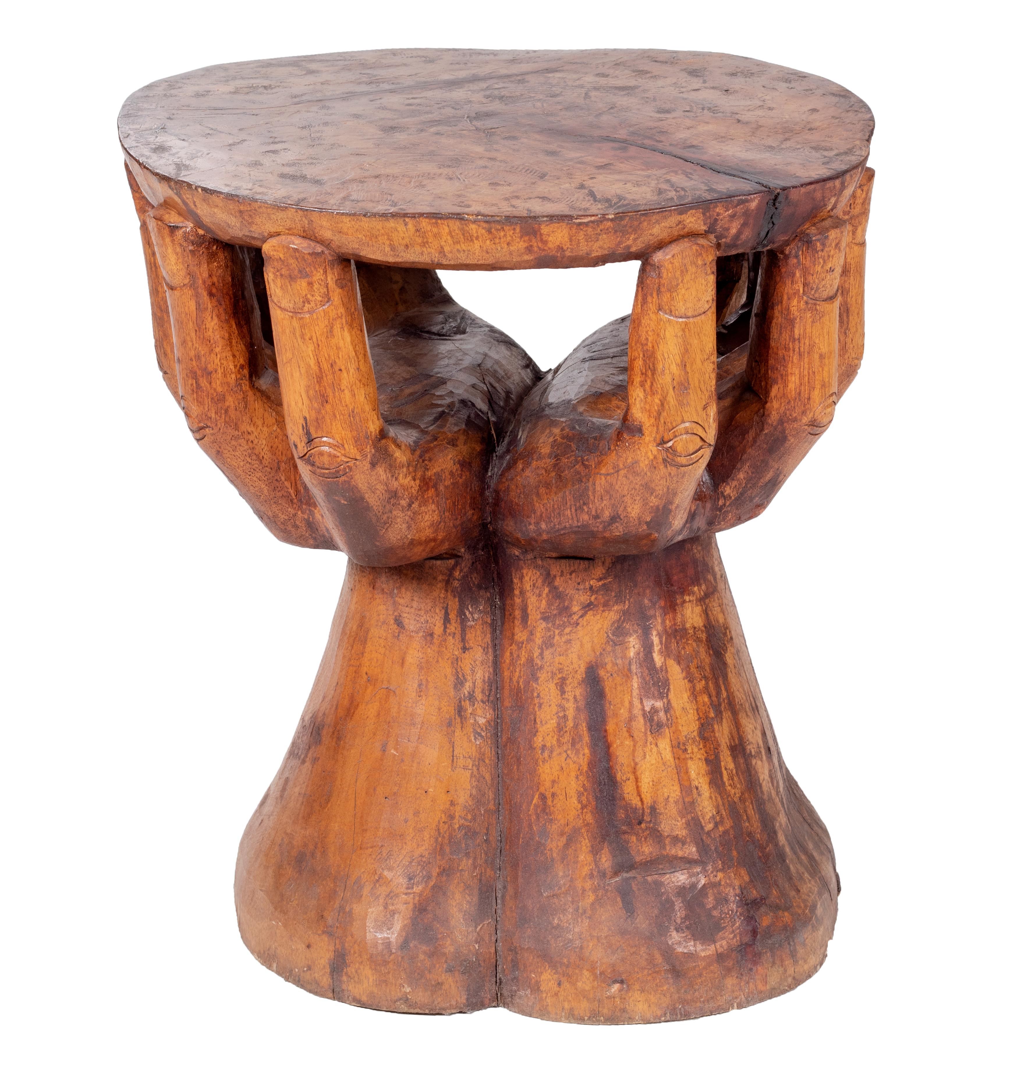 Hand shaped fruit wood set of table and four chairs. 

Measures of the table: 56 x 49 x 45 cm

Measures of the hands: 75 x 37 x 37 cm.