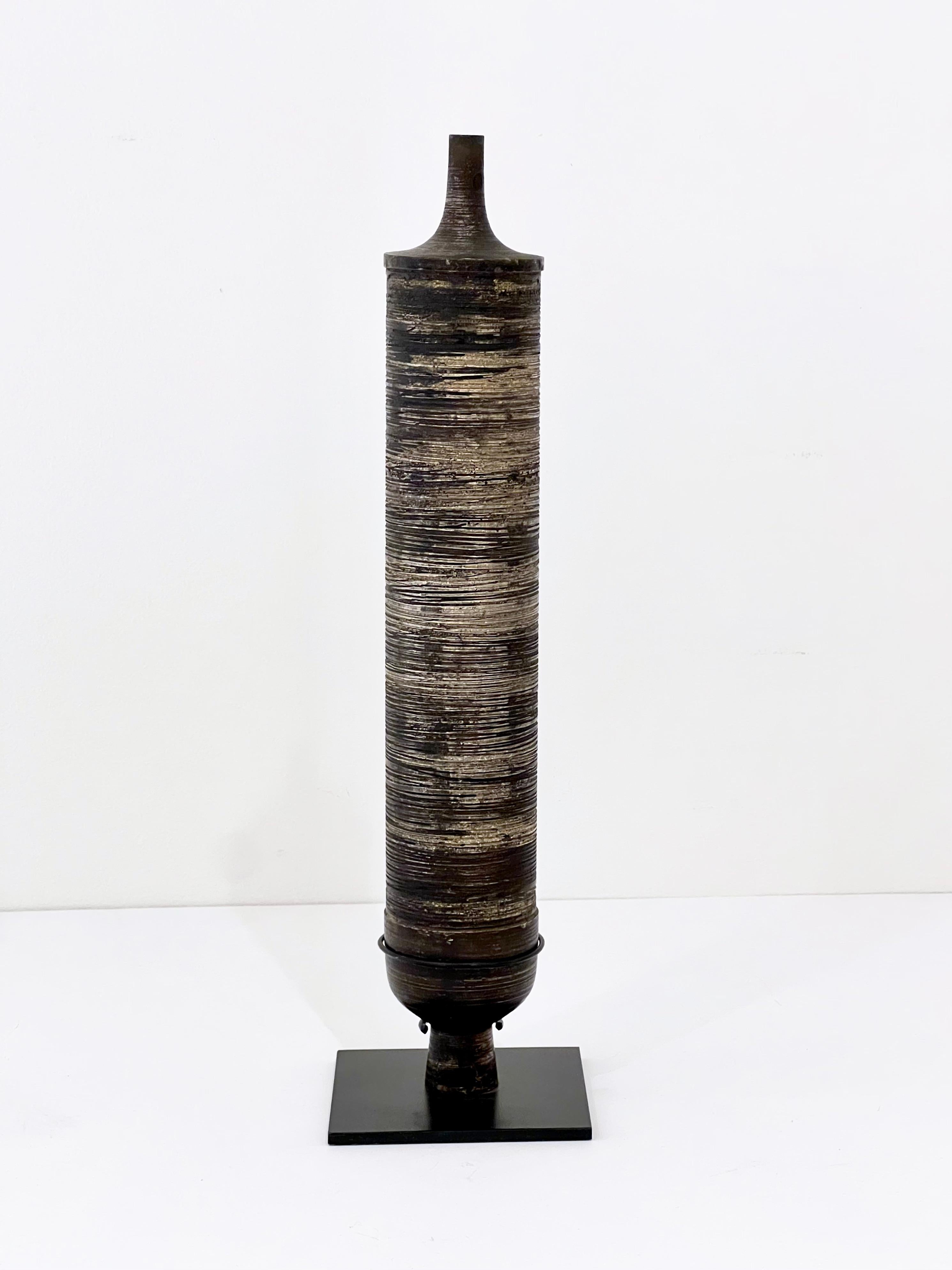 Striking hand-spun patinated bronze vase sculpture on stand by Lorenzo Burchiellaro, with great linear texture.  Italy 1955.