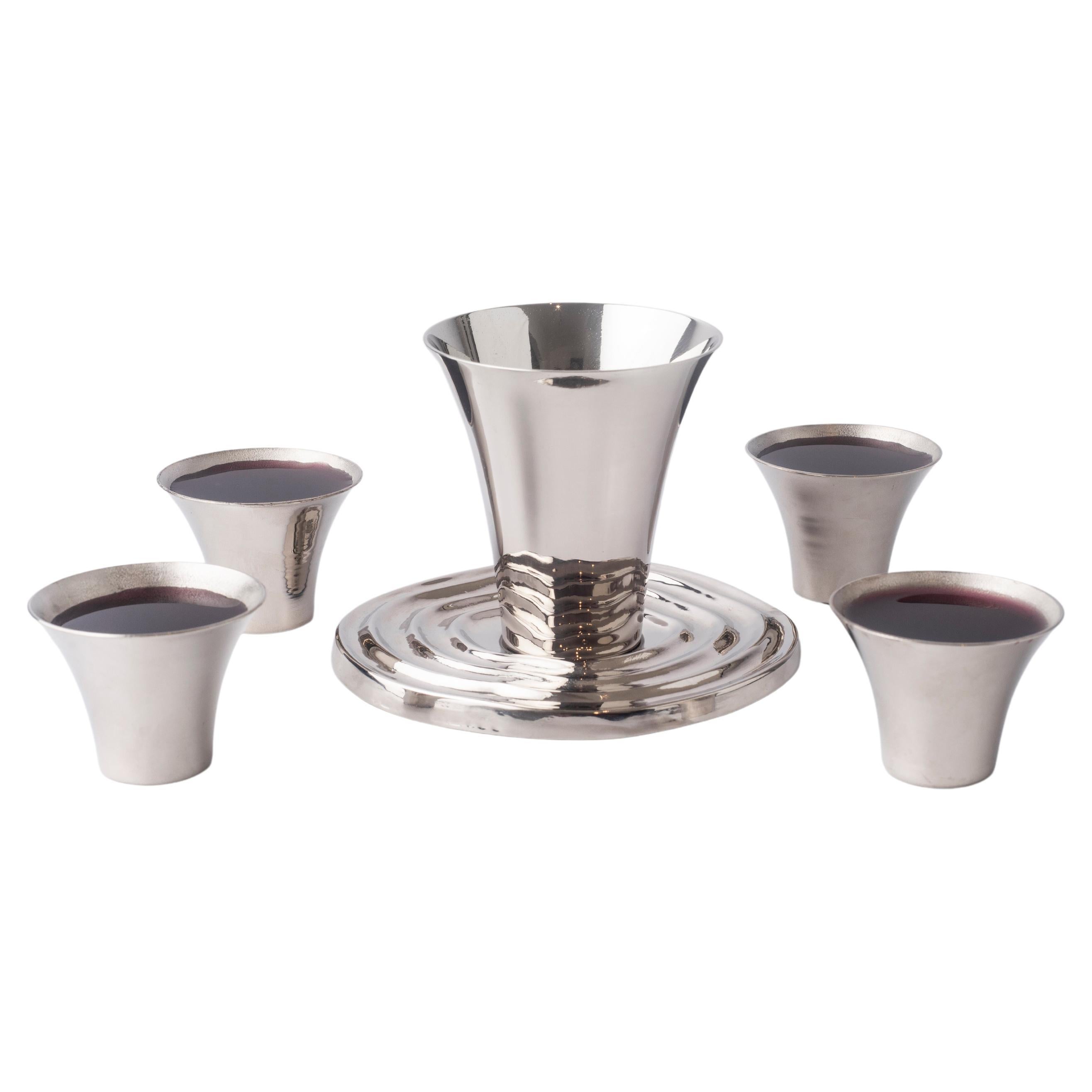 Overflow Hand-Spun Nickel-Plated Brass Kidussh Cup & Saucer with 4 Copitas Set For Sale