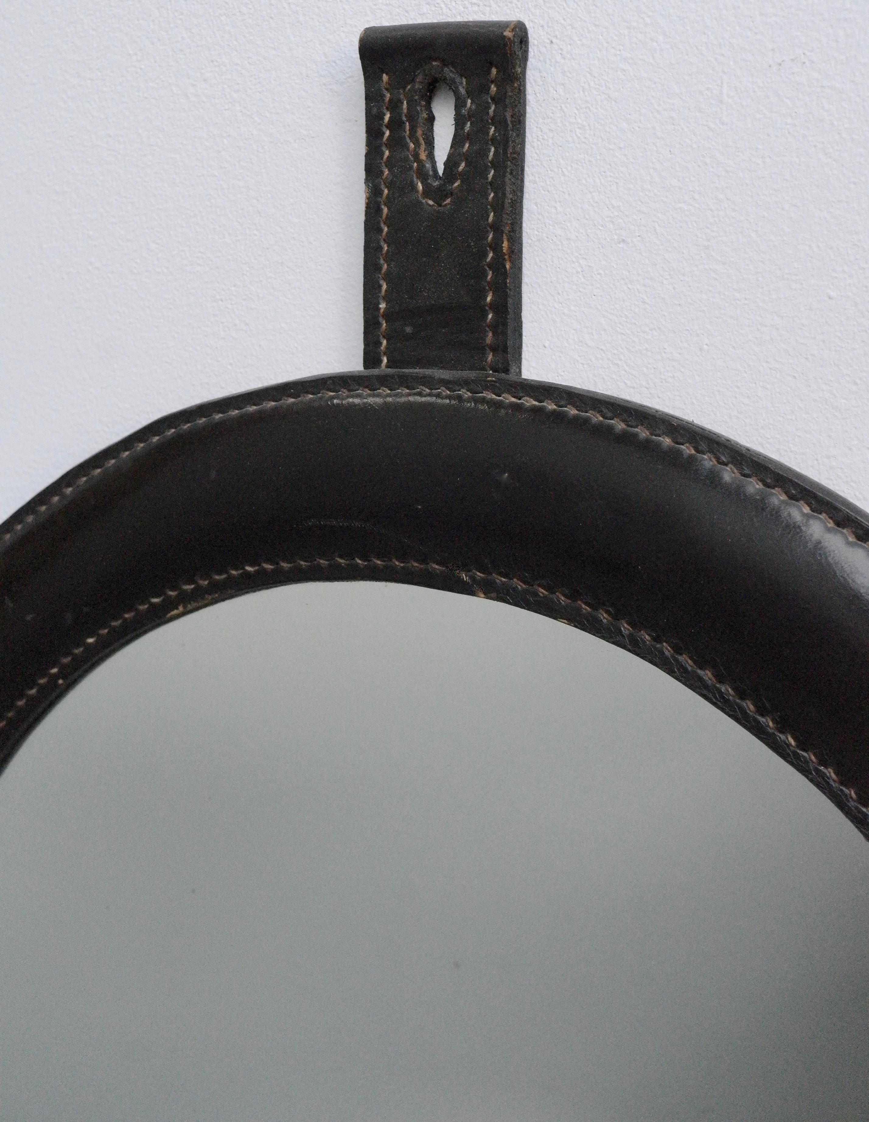 handstitched black leather wall mirror in style of Jacques Adnet.