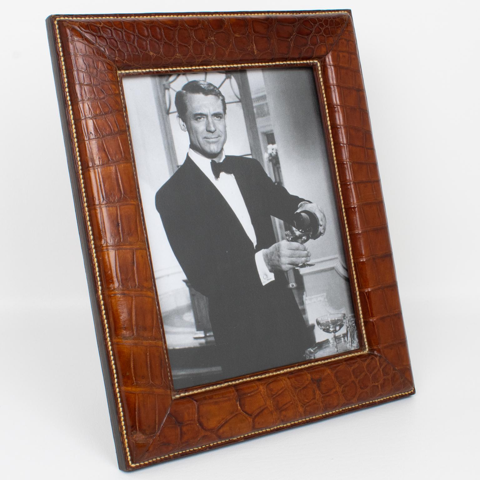 This luxury modernist leather picture photo frame was hand-crafted in France in the 1940s. This sophisticated piece boasts an all-leather construction built with thick multi-layers of leather, covered with crocodile skin leather on the front and