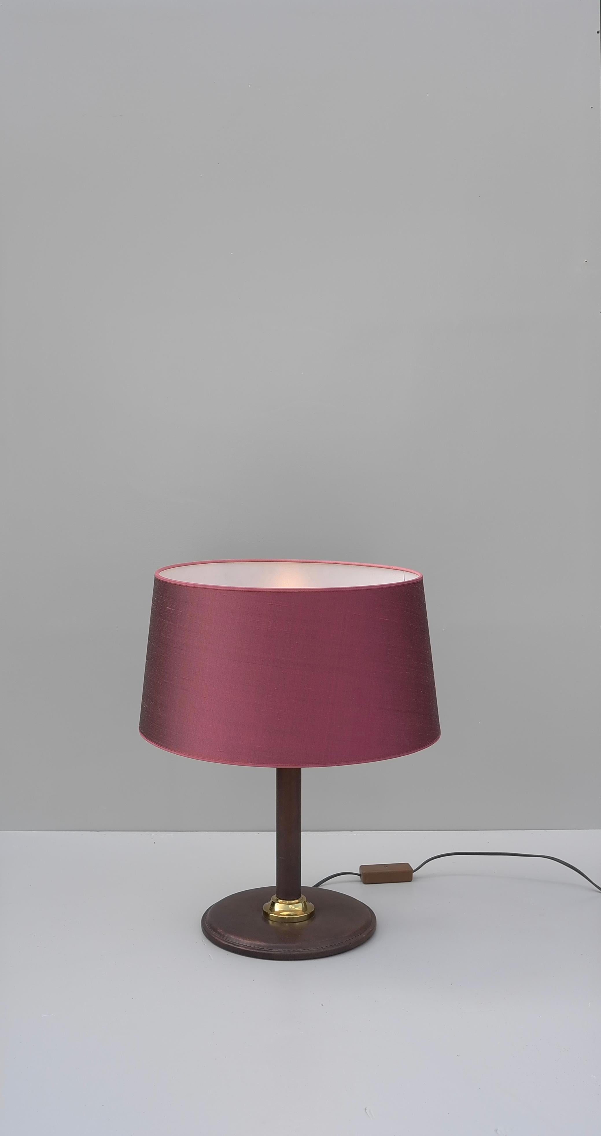 Hand-stitched brown leather table lamp with silk deep pinks shade, France, 1960s.