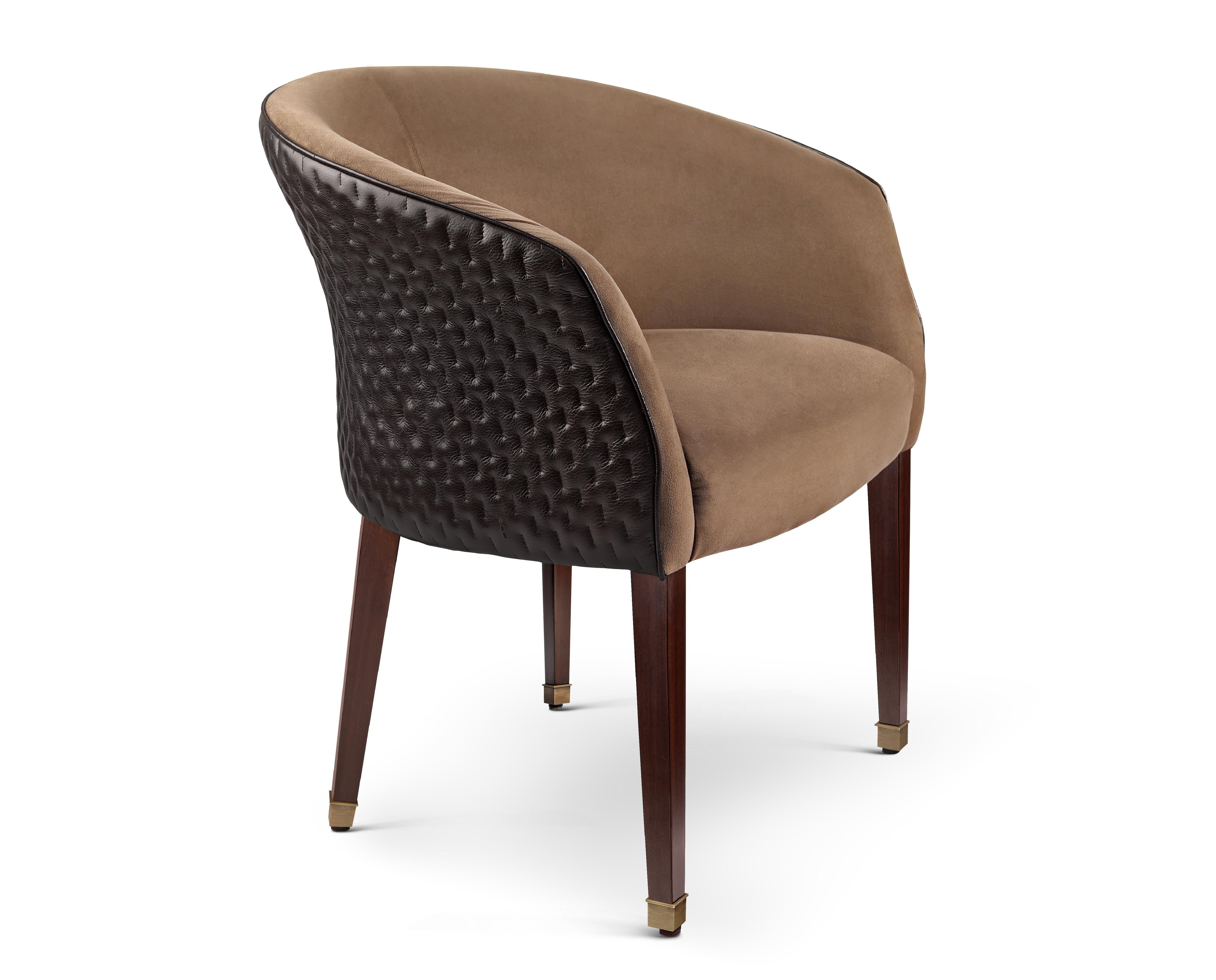 Hand stitched leather marla armchair by Madheke
Dimensions: W 60.8 x D 68 x H 80 cm.
Materials: Leather, Fabric, Wood, Metal.

The MARLA sets itself apart from its other contemporaries of the upholstery world with its precise attention to detail