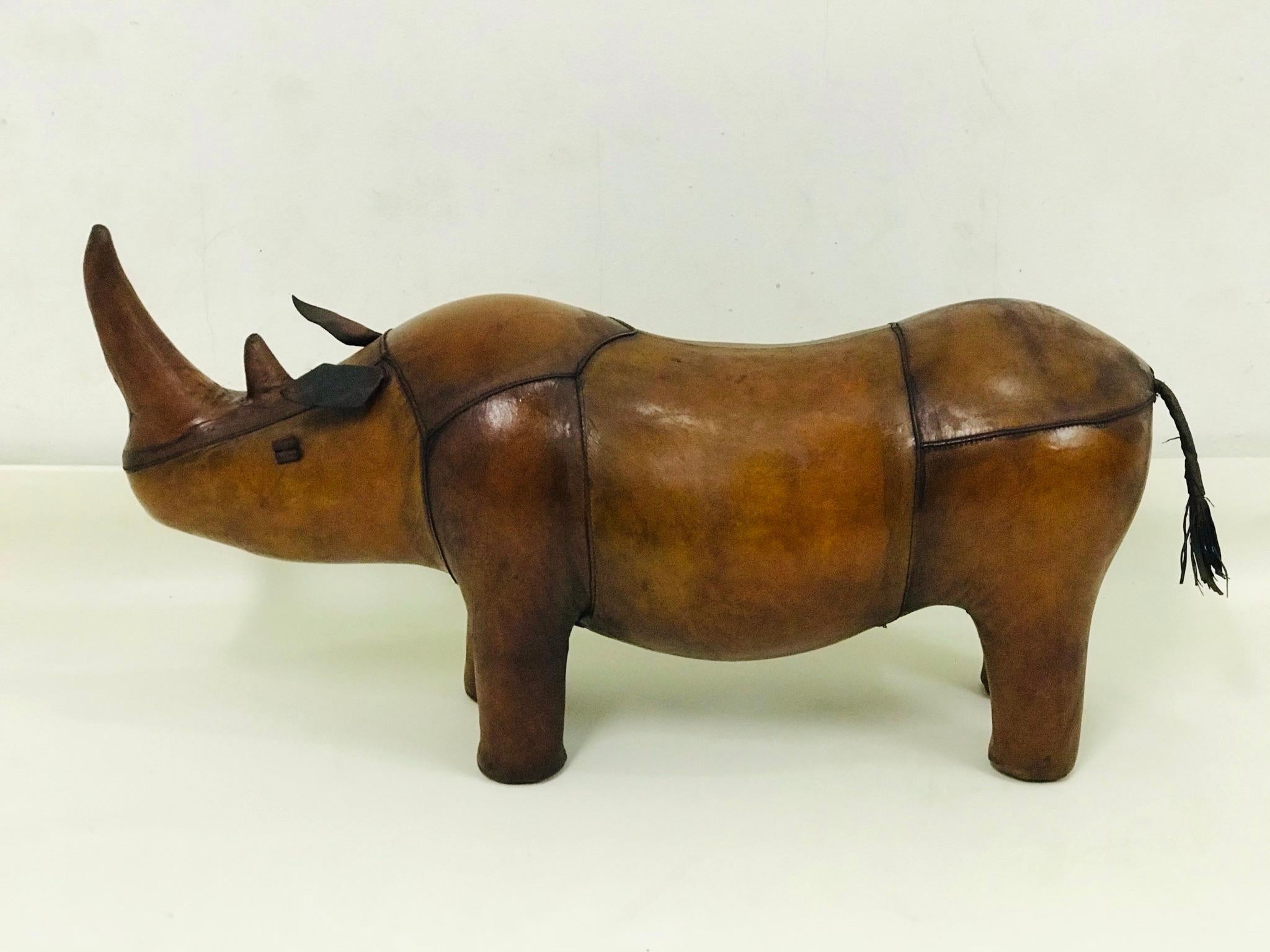 The rhino is in a nice original condition. It is leather and hand stitched. Decoration attached is a bonus for you. It consists of leather ball and dumbbell.