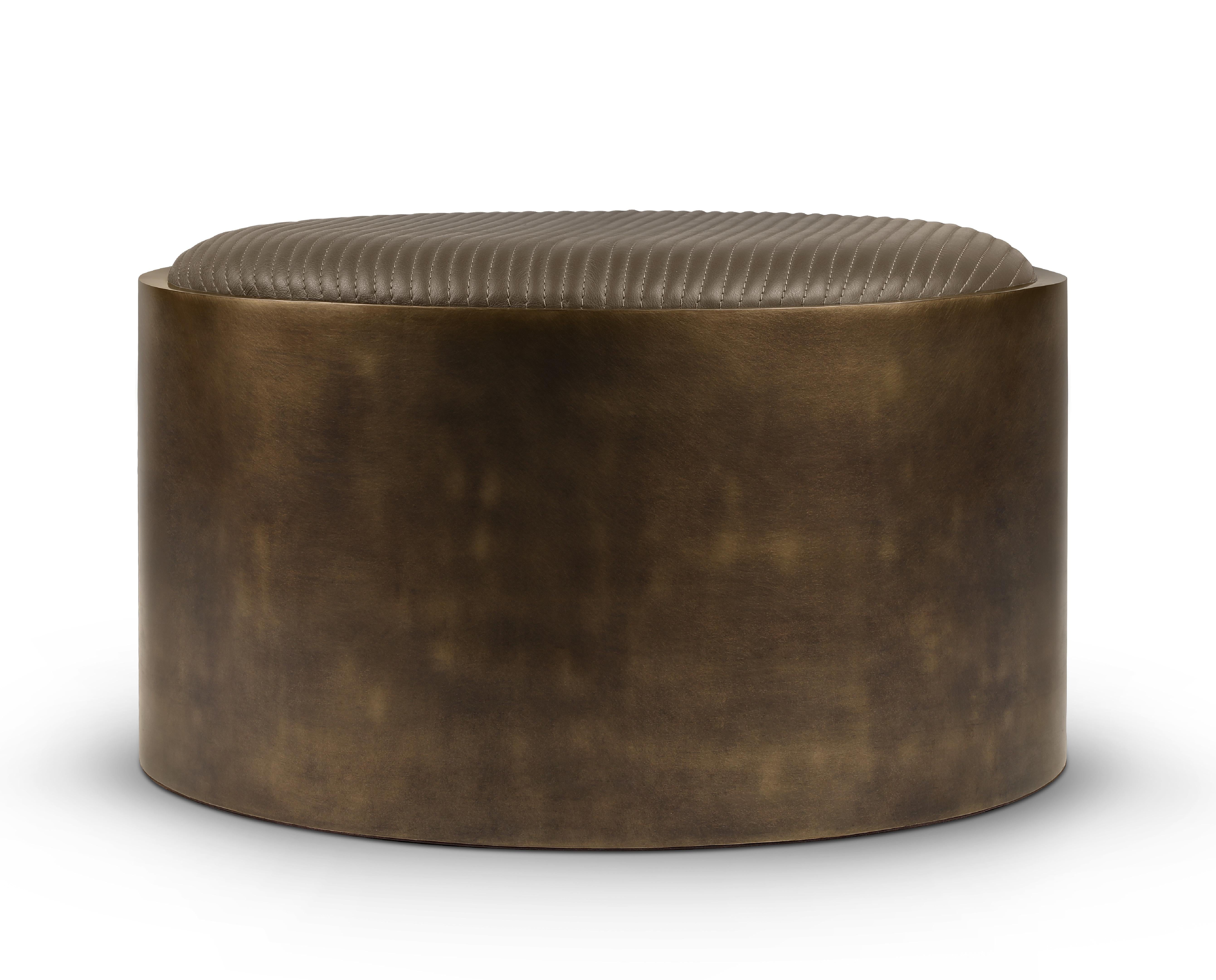 Handstitched Mira Pouf by Madheke.
Dimensions: W 53 x D 53 x H 31.5 cm.
Materials: Leather, metal.

Finished in a deep bronzed olive tone the MIRA’s earthy palette will adapt to most interiors. Detailed with a linear stitch detail and