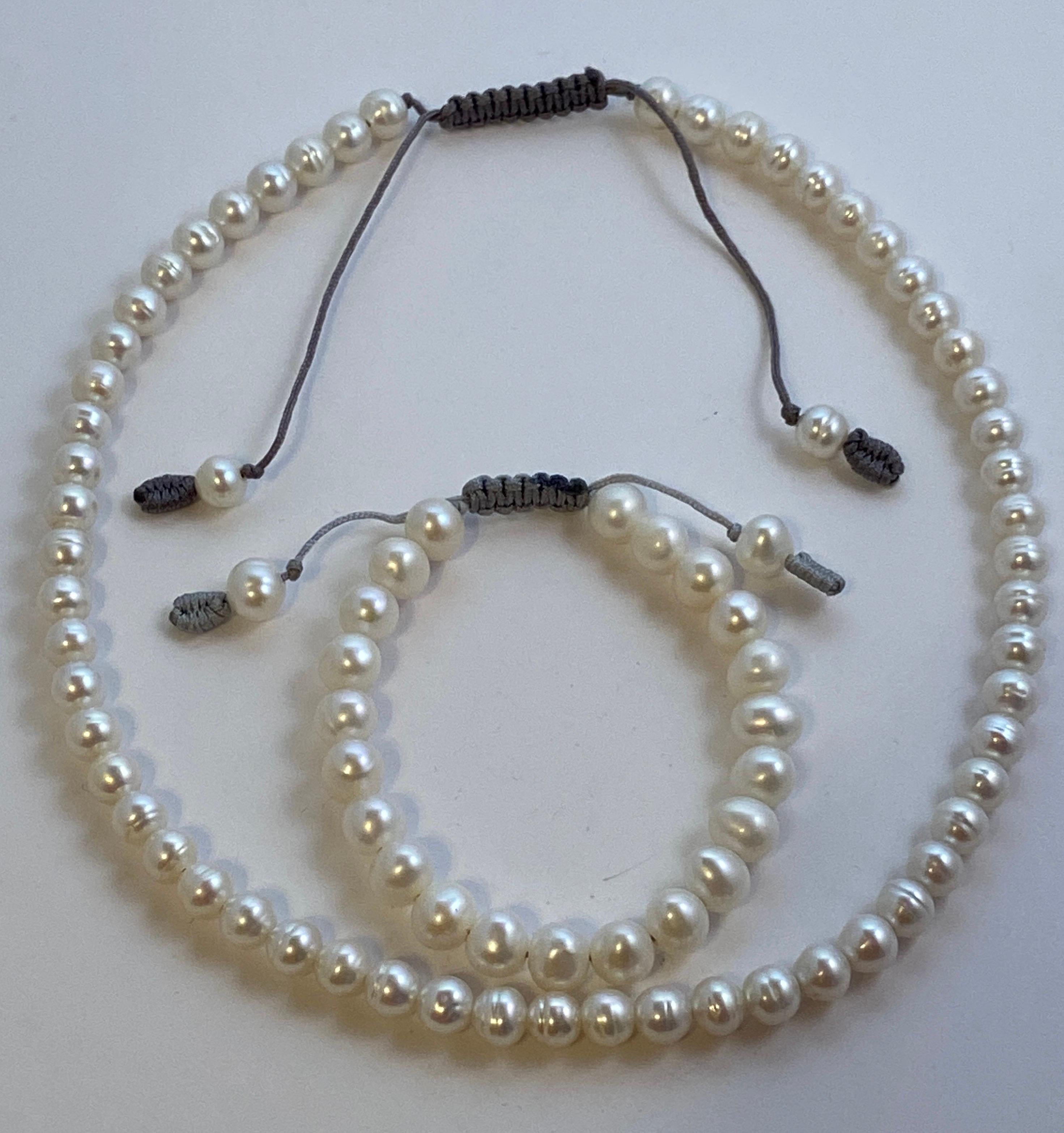 Set of hand-strung pearl necklace with matching bracelet set has adjustable options to widen if desire. Just gently pull the hand-knotted string to adjust. The necklace measures 17 1/2 inches at the smallest and 22 3/4 inches at the longest. The