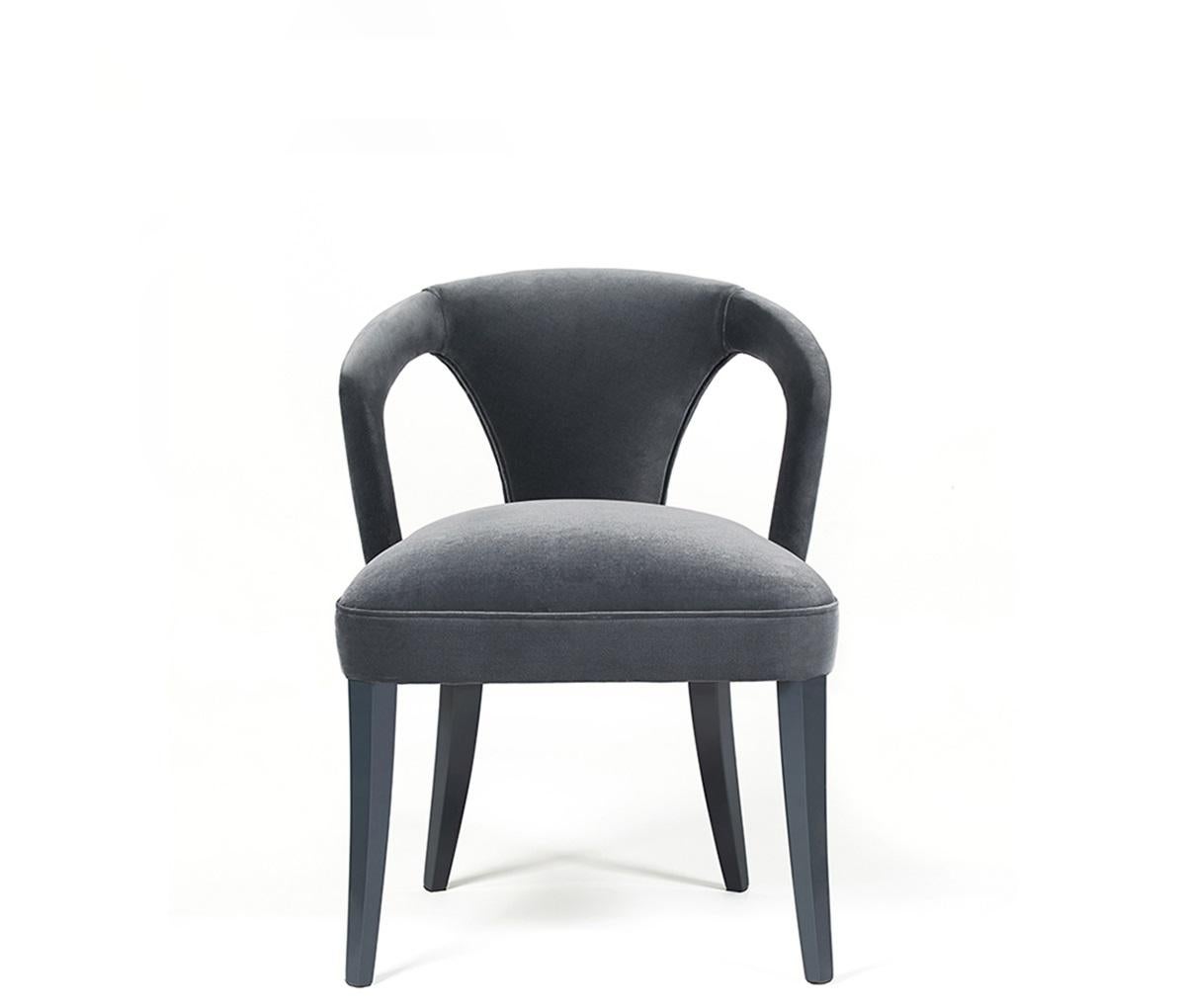 Sculptural and fashionable, this chair draws inspiration from miniskirts and the style icons of the 1960’s. The fine low backrest and long legs are a tribute to its influences, and a statement for a dining room. The chair is characterized by clean