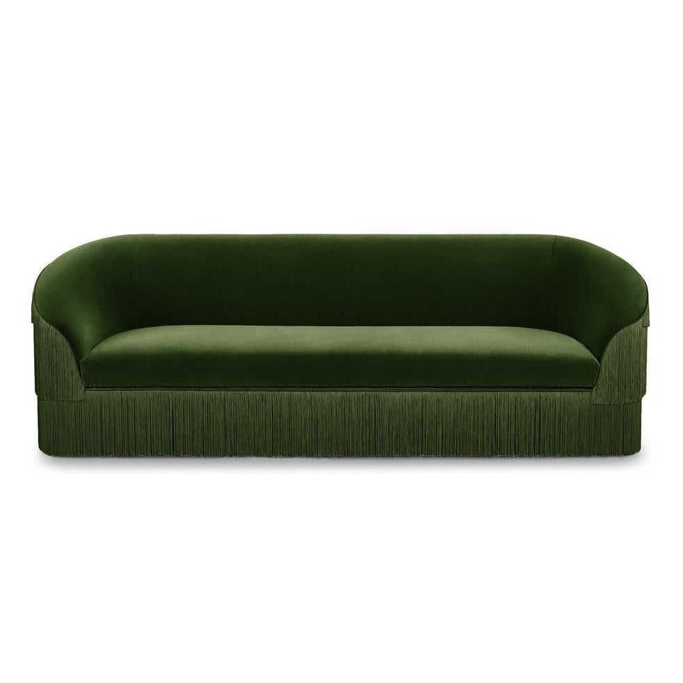 The handmade sofa draws on the signature fashion theme, ruffling the scene and inviting guests with its fun and flirtatious feel. Featuring three layers of fringes that run along the front and reverse of the wide seat, set against a curved backrest