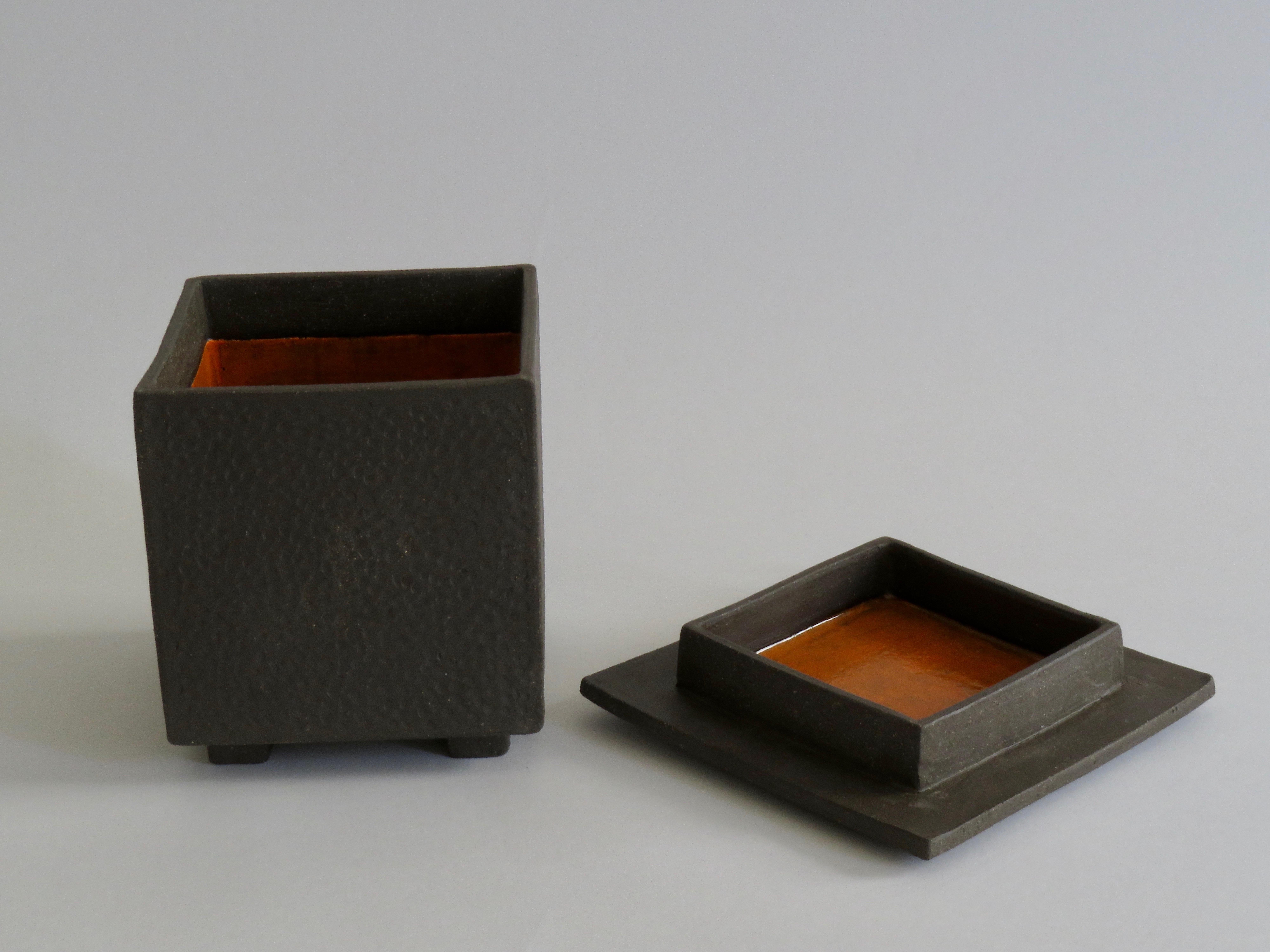 Hand built ceramic box. Subtly hand-textured clay box with a matching lid. The bare clay exterior highlights the handmade texture while an interior glaze surprises and shines. Very Japanese in design and attitude: quiet yet strong. Beautiful
