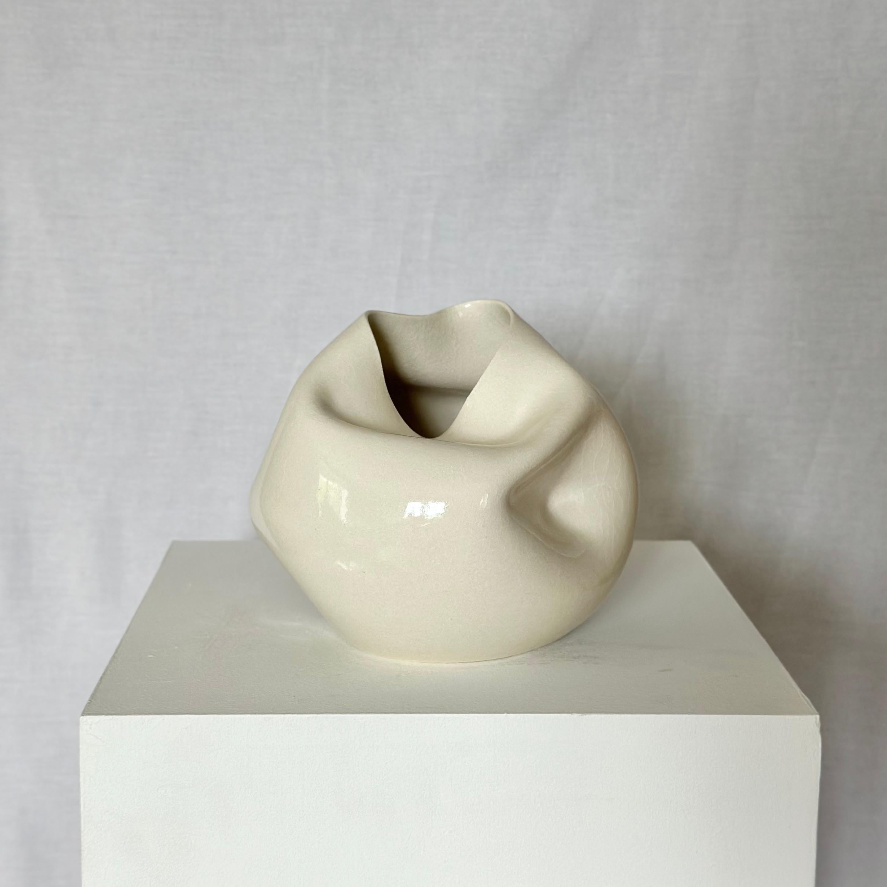 Hand thrown and altered ceramic vase by Norwegian artist Johanne Birkeland.

Birkeland, who works under the artist name Jossolini, is known for her special techniques in altering her wheel thrown forms. 

Once the form has been thrown and trimmed at