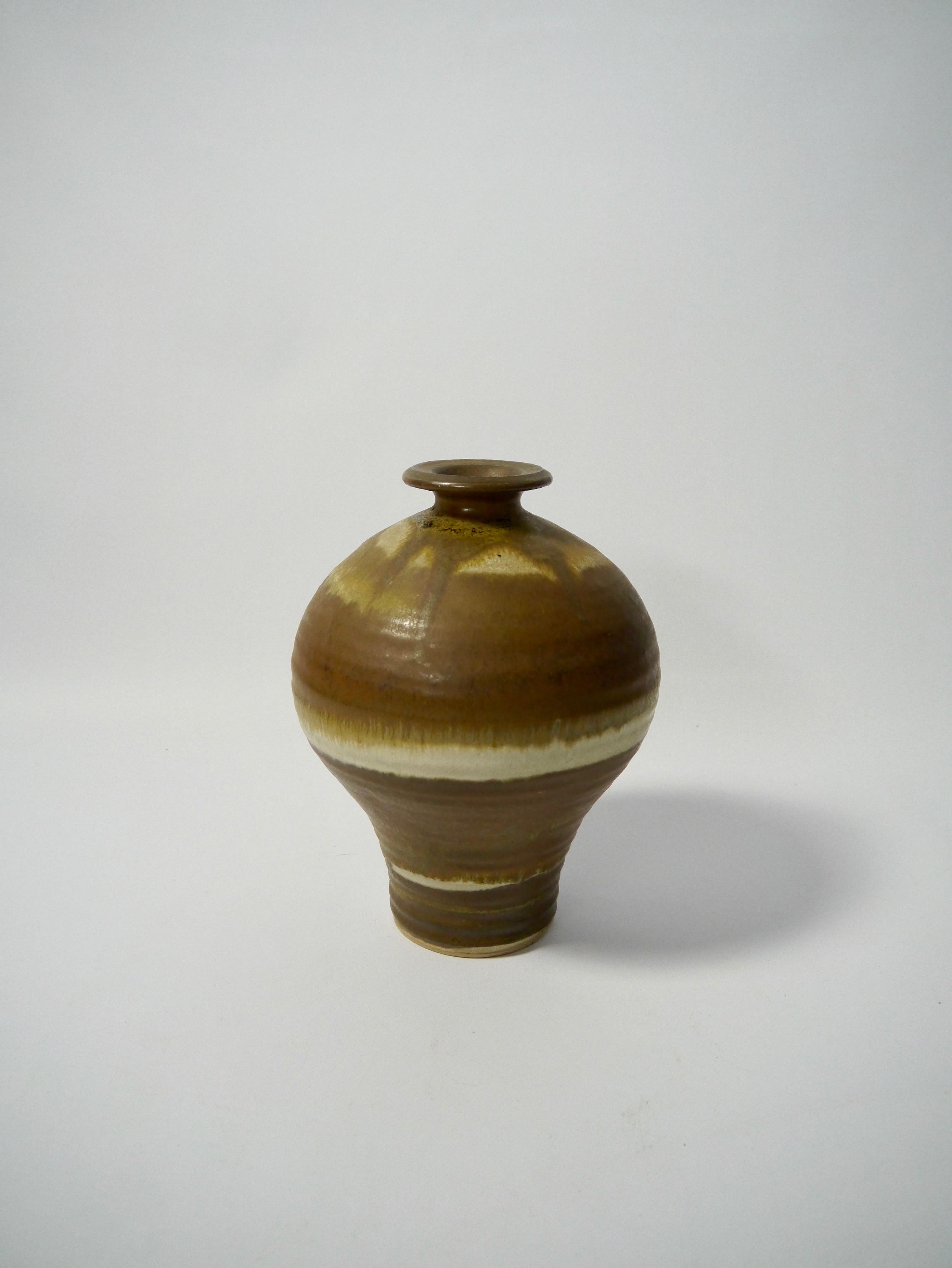 Hand thrown ceramic vase, classic style shape, earth toned wabi-sabi glaze. Unknown maker, see stamp at base.