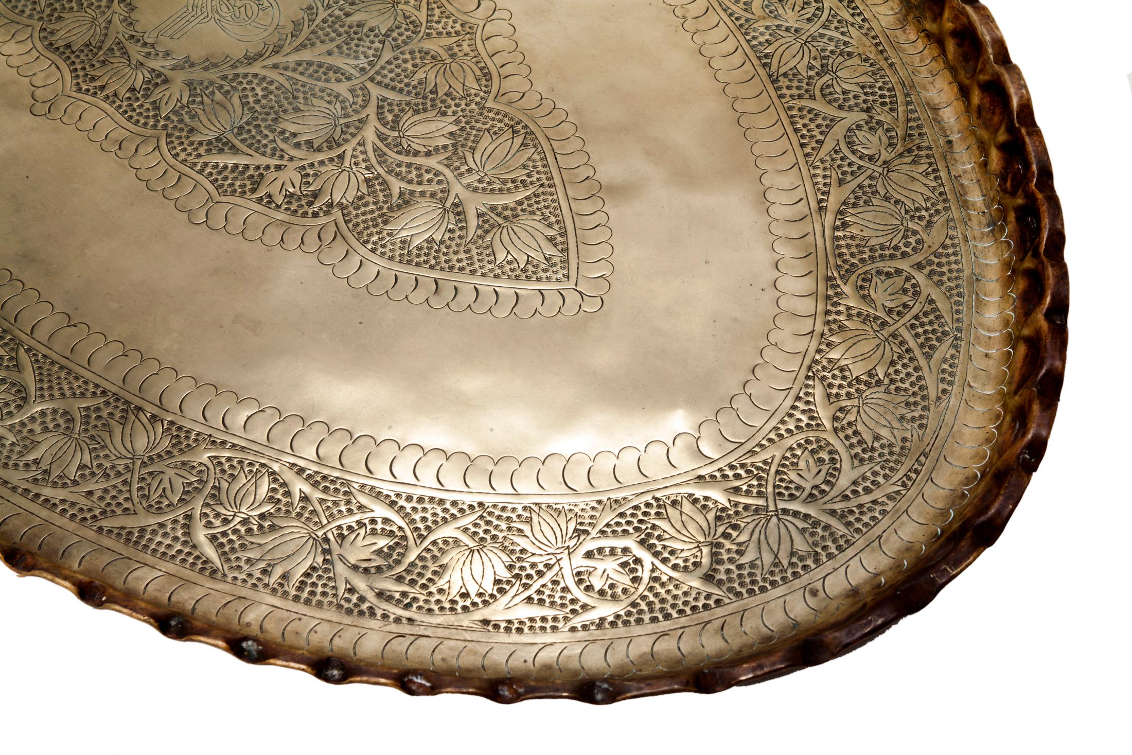Fabulous very large handcrafted oval decorative brass tray.
Very fine metalwork, hand-hammered & embossed with a floral pattern & center medallion with a fluted edge.
Great to use on a coffee table or ottoman.