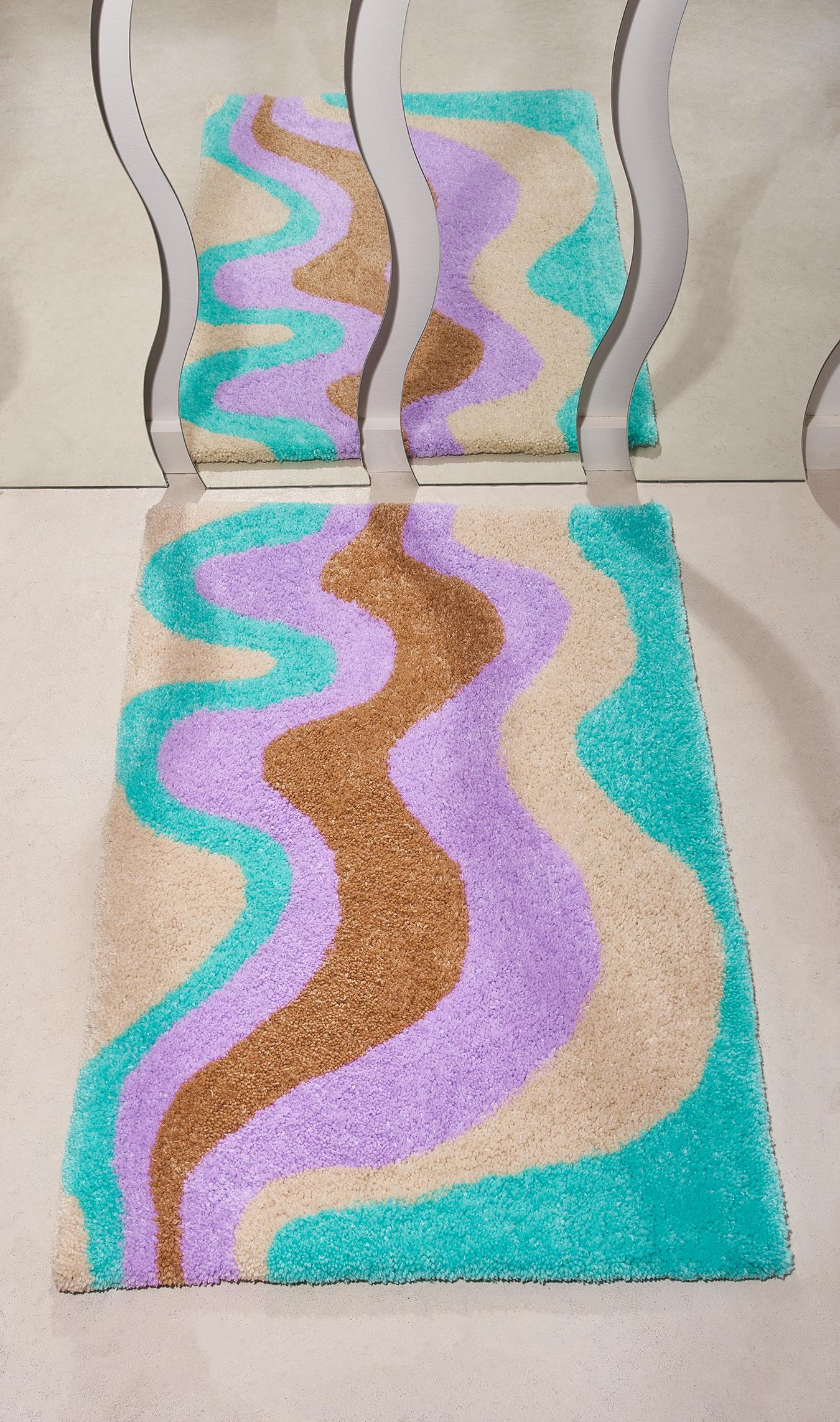 Hand tufted cut-pile rug in a wavy pastel design. The design is inspired by 70s psychadelic art. 

I design & hand tuft all of my pieces, it is truly art for your floor. It can also be used as a wall hanging!

Acrylic yarn

3 feet by 2