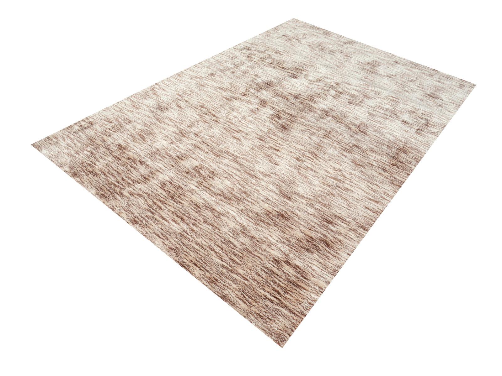 Hand Tufted Tiger Rug in Beige, Brown, Cinnamon 6 x 4 ft, using fine Bamboo Silk.

This light-colored rug has a silk like luster. It was hand-tufted in India with three different colored yarns: beige, cinnamon and brown. The design is a petite tiger