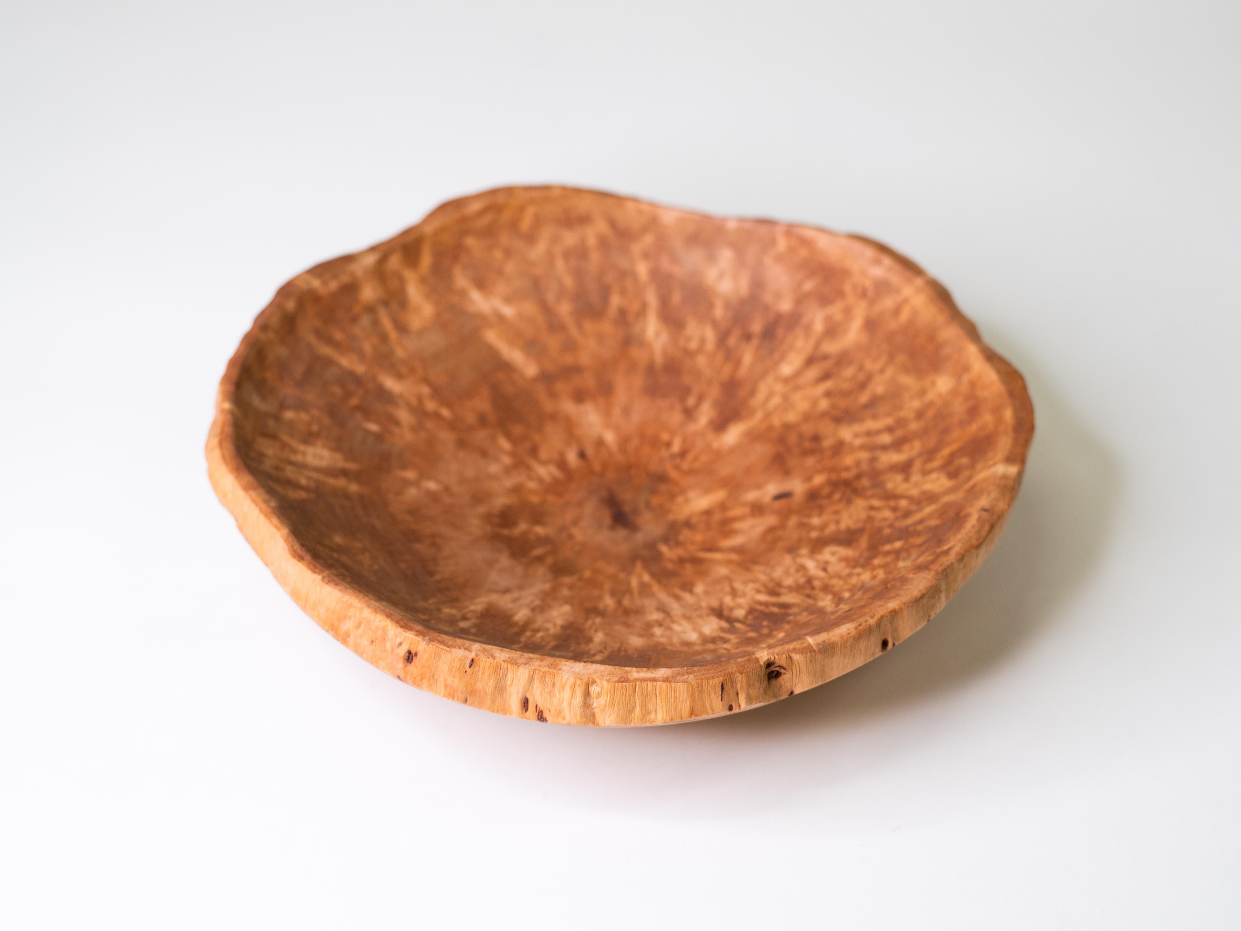 A beautifully hand-turned bowl made in Finland from curly birch, one of the country’s most prized native woods. The surface reveals the flame-like figuring characteristic of visakoivu, with its natural shimmer and lively pattern. Gently asymmetrical