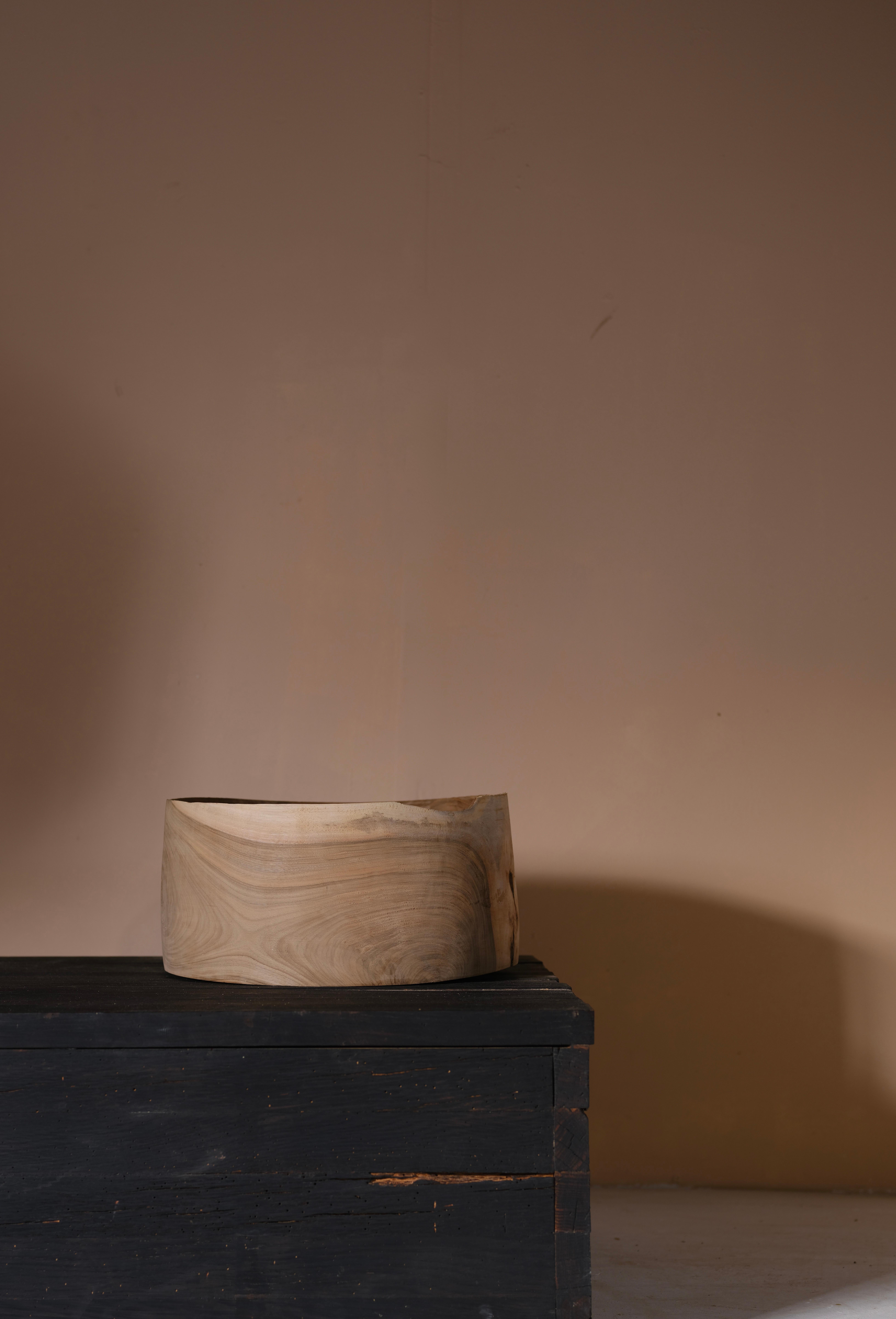 A super fine, English Walnut Dish, hand turned on a woodturning lathe to an exceptionally fine thickness. The piece remains un-oiled and so has kept its beautiful natural appeal with dusty tones contrasting between the pale sapwood and the darker