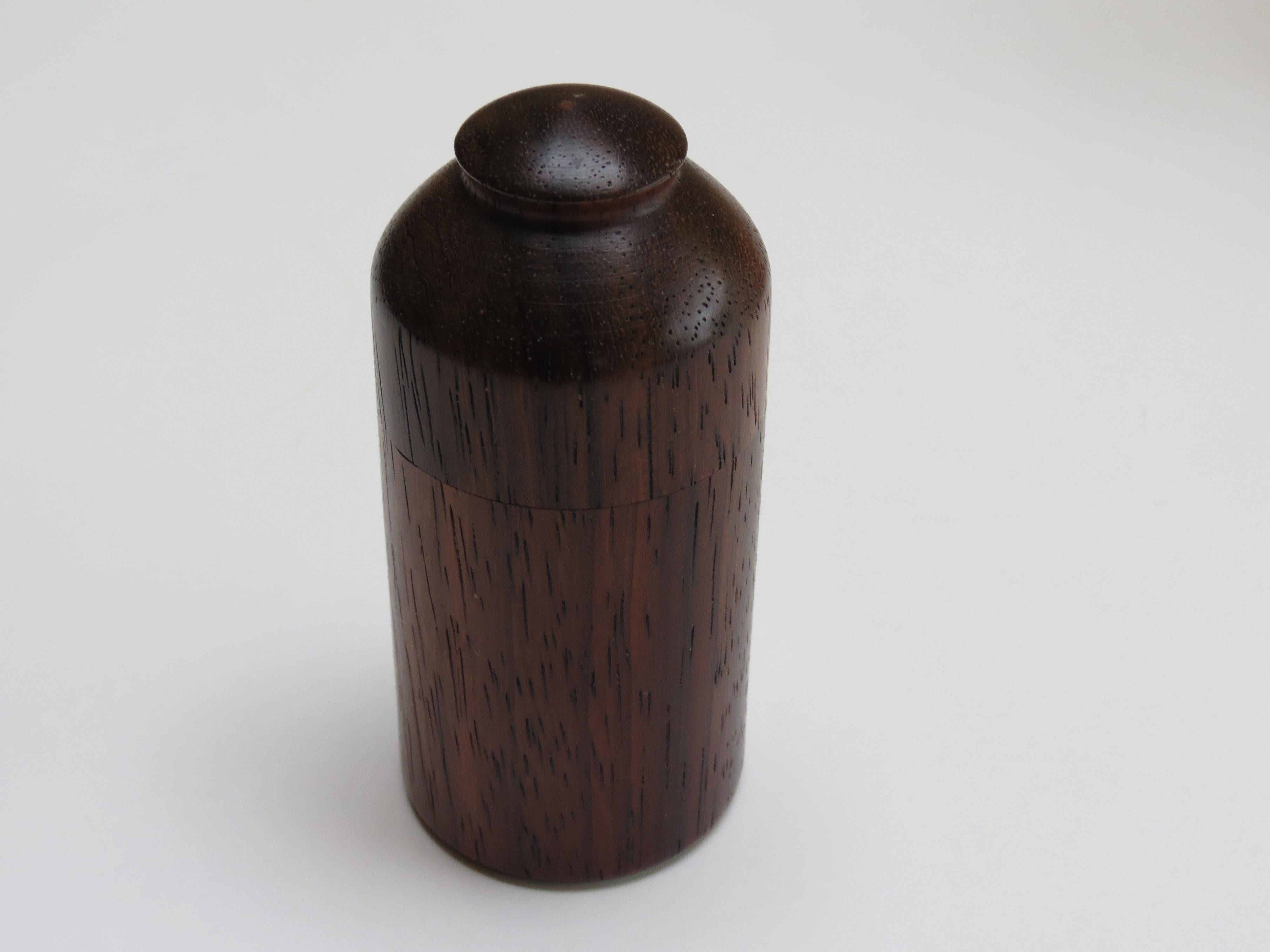 Wonderful hand produced pot with lid. Turned from Padauk, the colour has mellowed with age, dates from the 1970s. 
Green baize to the base.  Lid removes.  In good over all condition. 