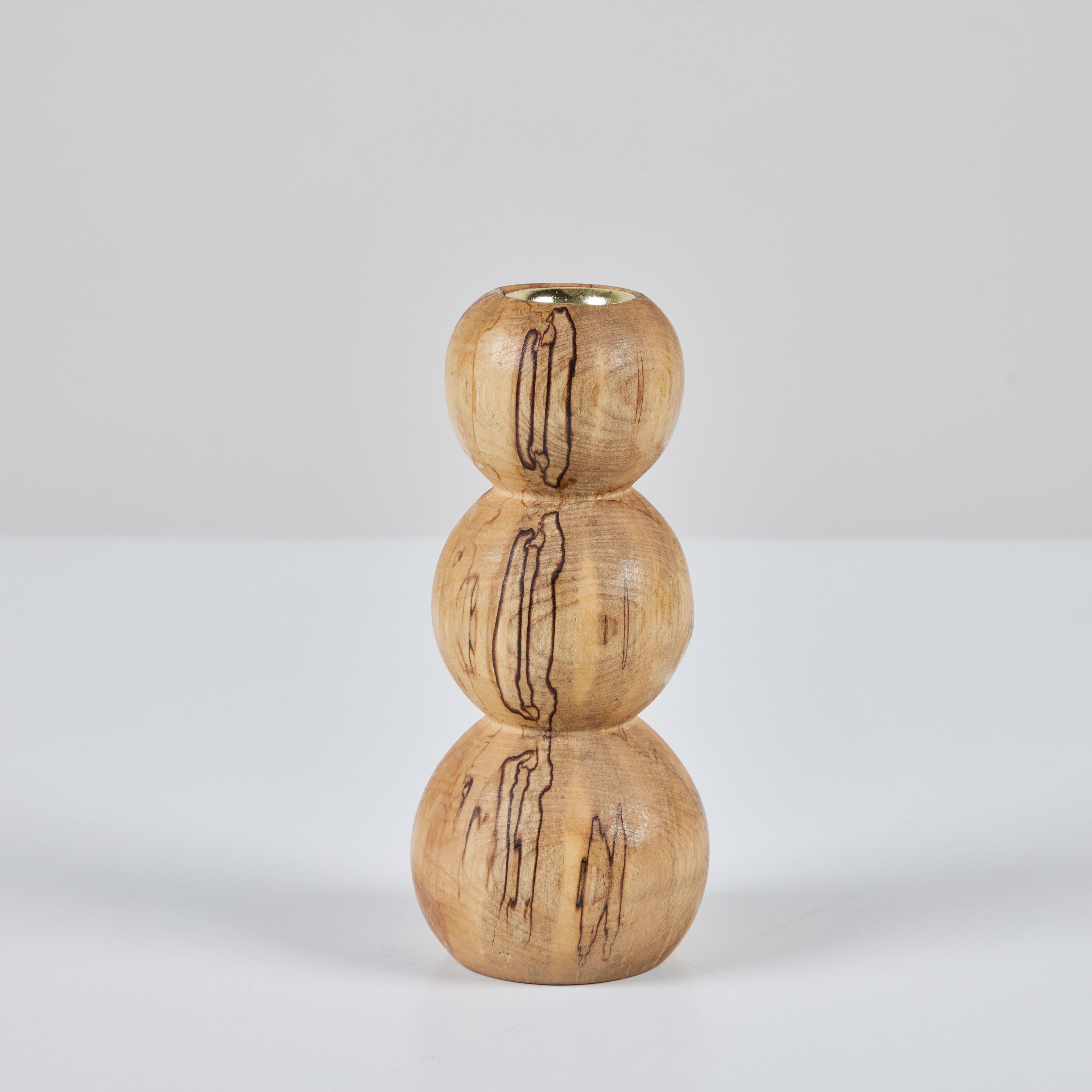 Hand crafted candlestick in spalted birch by local Los Angeles artist Evan Segota. The candle holder features a bubble shape and inset brass cup.

Evan Segota is a furniture / product / object designer and artist with a BS in industrial design, and