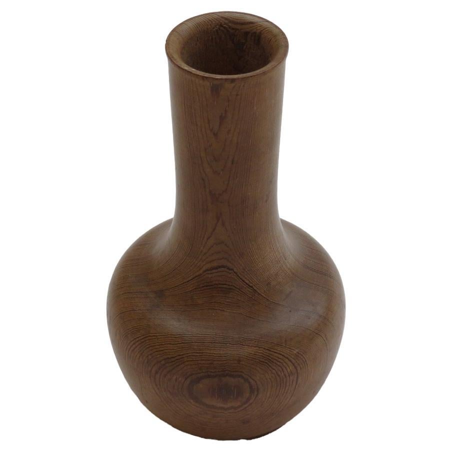 Vintage hand turned pine vase shape sculpture. dating from the 1970s. Made from Pitch Pine, the shape of the sculpture shows the wonderful grain of the Pine. Very skillfully turned, the hollow to the neck of the vase is halfway down the piece, the