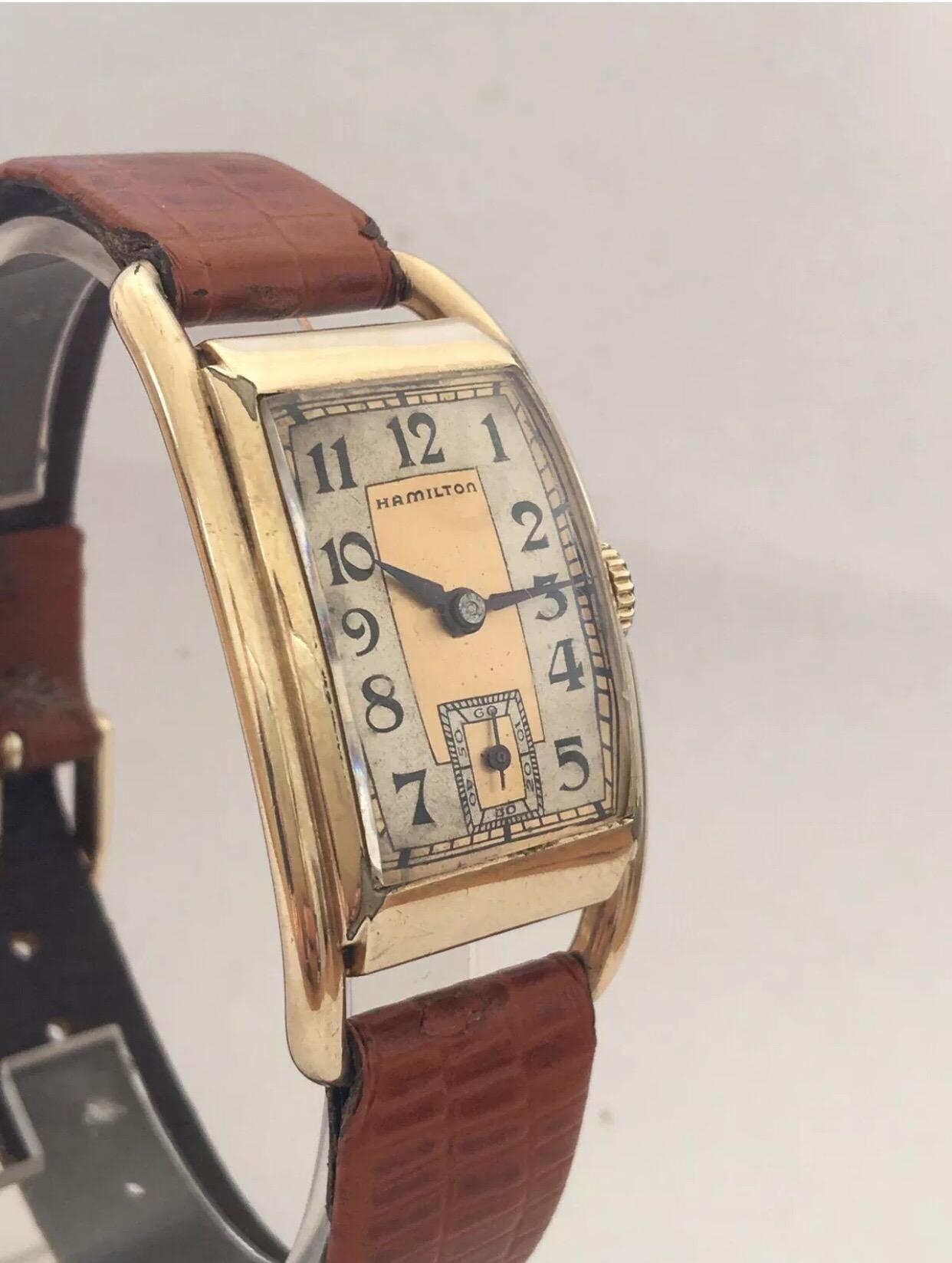 Hand-winding 14K Gold Filled 1940’s Vintage Hamilton Wristwatch.


This beautiful vintage watch is working and ticking well. Watch case is a bit tarnished a a tiny dent on the back case as shown. Please study the images carefully as form part of